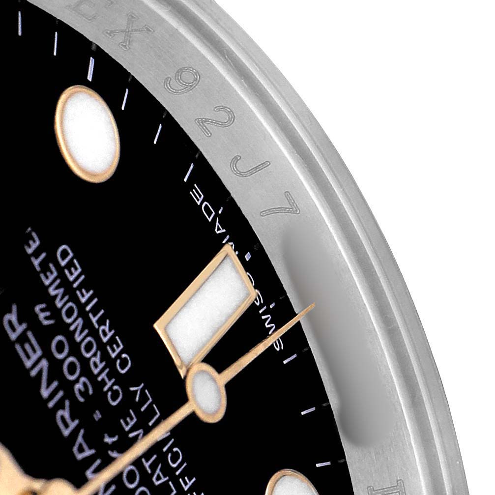 The image shows a close-up of the Rolex Submariner 116613 Men's Stainless Steel Black Dial dial and partially visible bezel, displaying hands and hour markers.