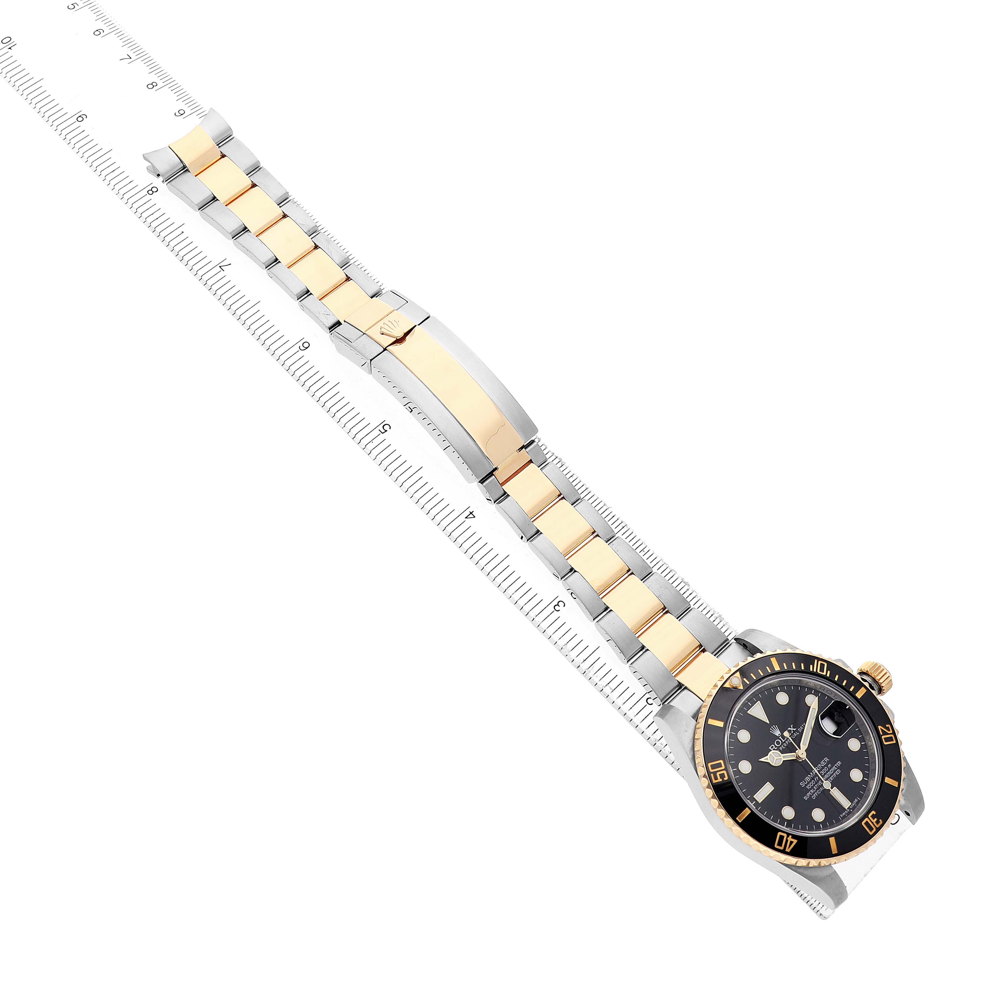 The Rolex Submariner 116613 Men's Stainless Steel Black Dial watch is angled diagonally, showing the face, bezel, and bracelet in gold and silver tones.