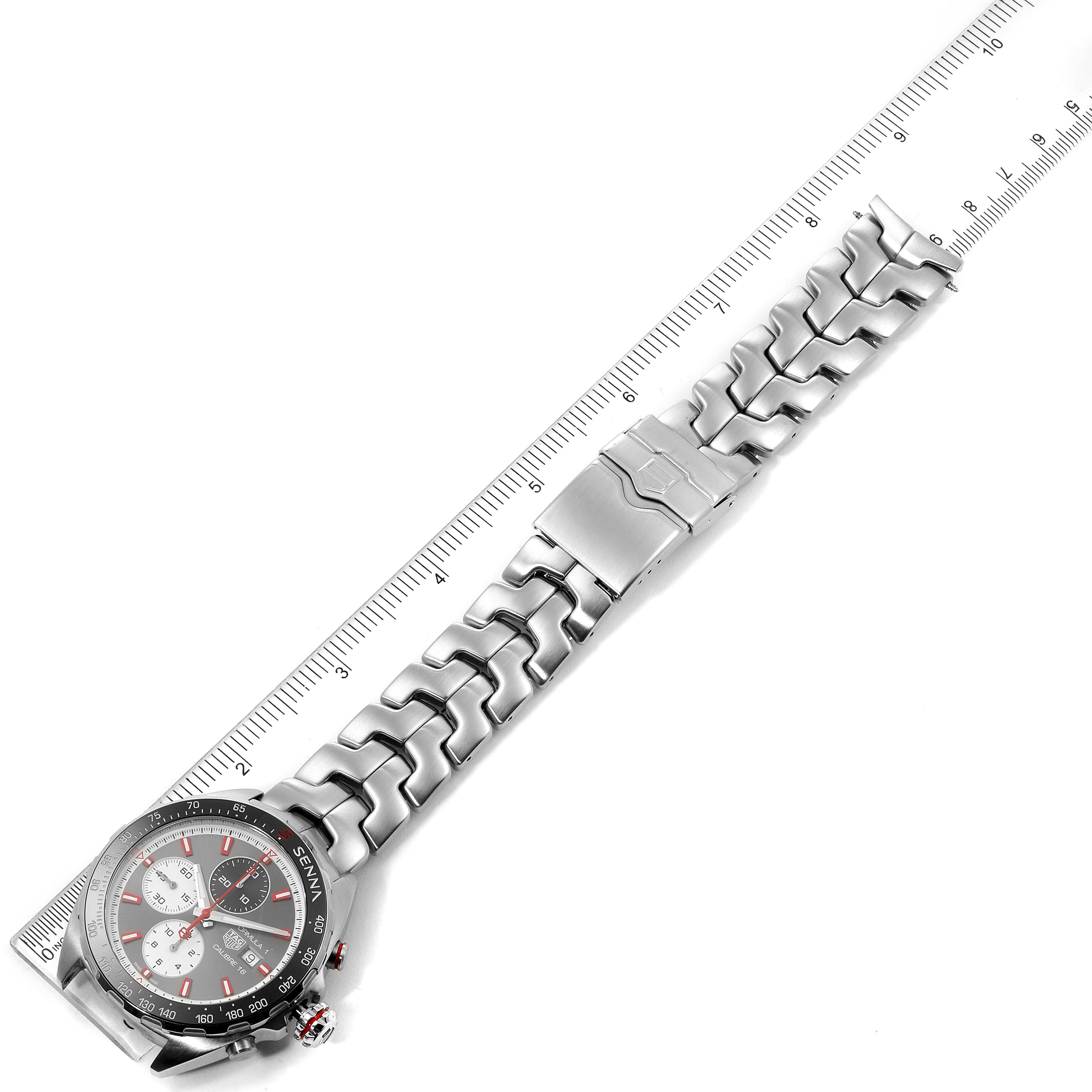 This image shows a top-down view of the Tag Heuer Formula 1 CAZ2017.BA0647 Men's Stainless Steel Grey Dial CAZ2017.BA0647 Men's Stainless Steel Grey Dial watch, including the dial, bracelet, and clasp placed on a ruler.