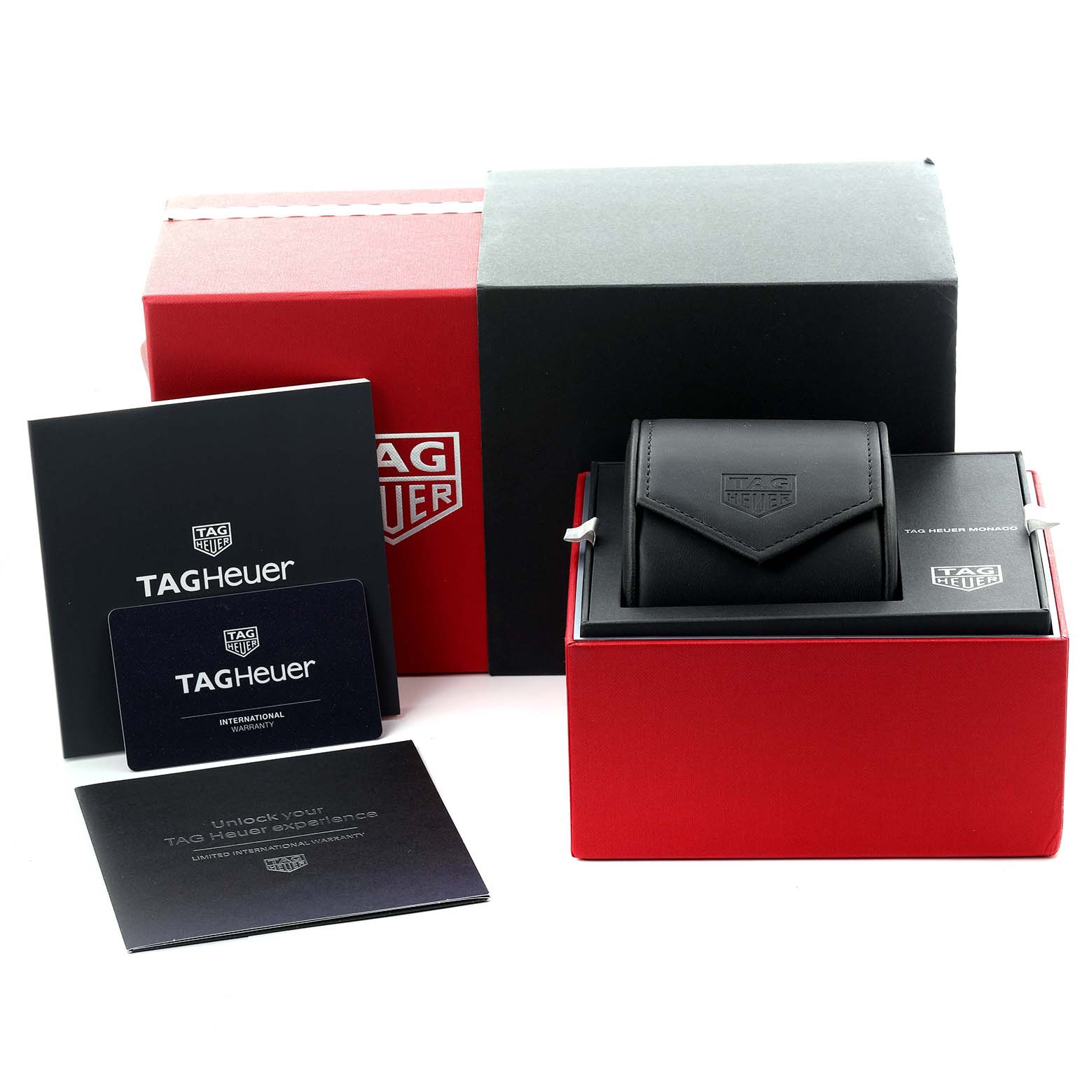 The image shows a Tag Heuer Monaco CBL2113.FC6177 Men's Stainless Steel Black Dial CBL2113.FC6177 Men's Stainless Steel Black Dial watch case, box, warranty card, and instruction manuals from a front angle.