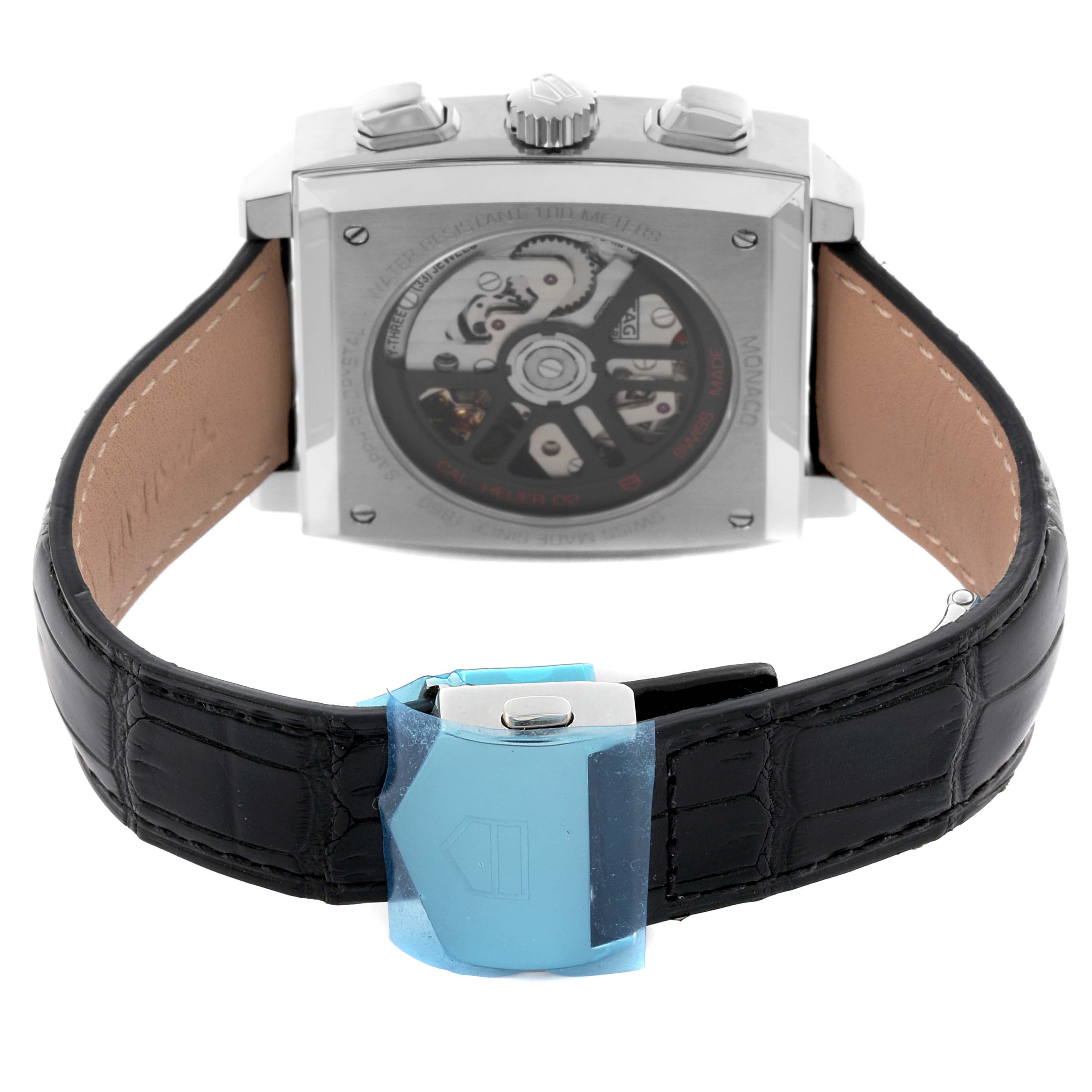 This image shows the back of a Tag Heuer Monaco CBL2113.FC6177 Men's Stainless Steel Black Dial CBL2113.FC6177 Men's Stainless Steel Black Dial watch, highlighting its caseback and the leather strap with a blue clasp.