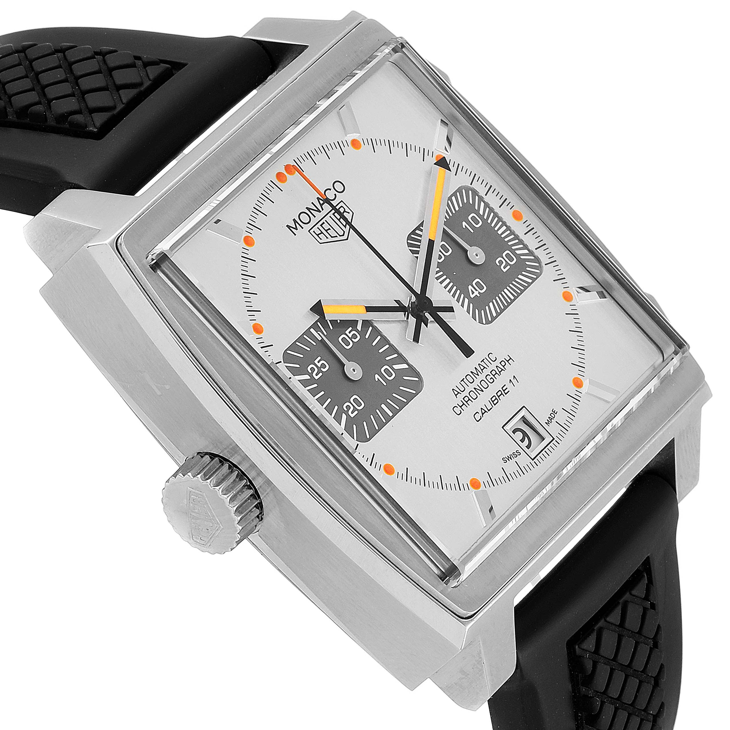 The image shows a Tag Heuer Monaco watch from a side angle, highlighting its square dial, chronograph sub-dials, and crown.