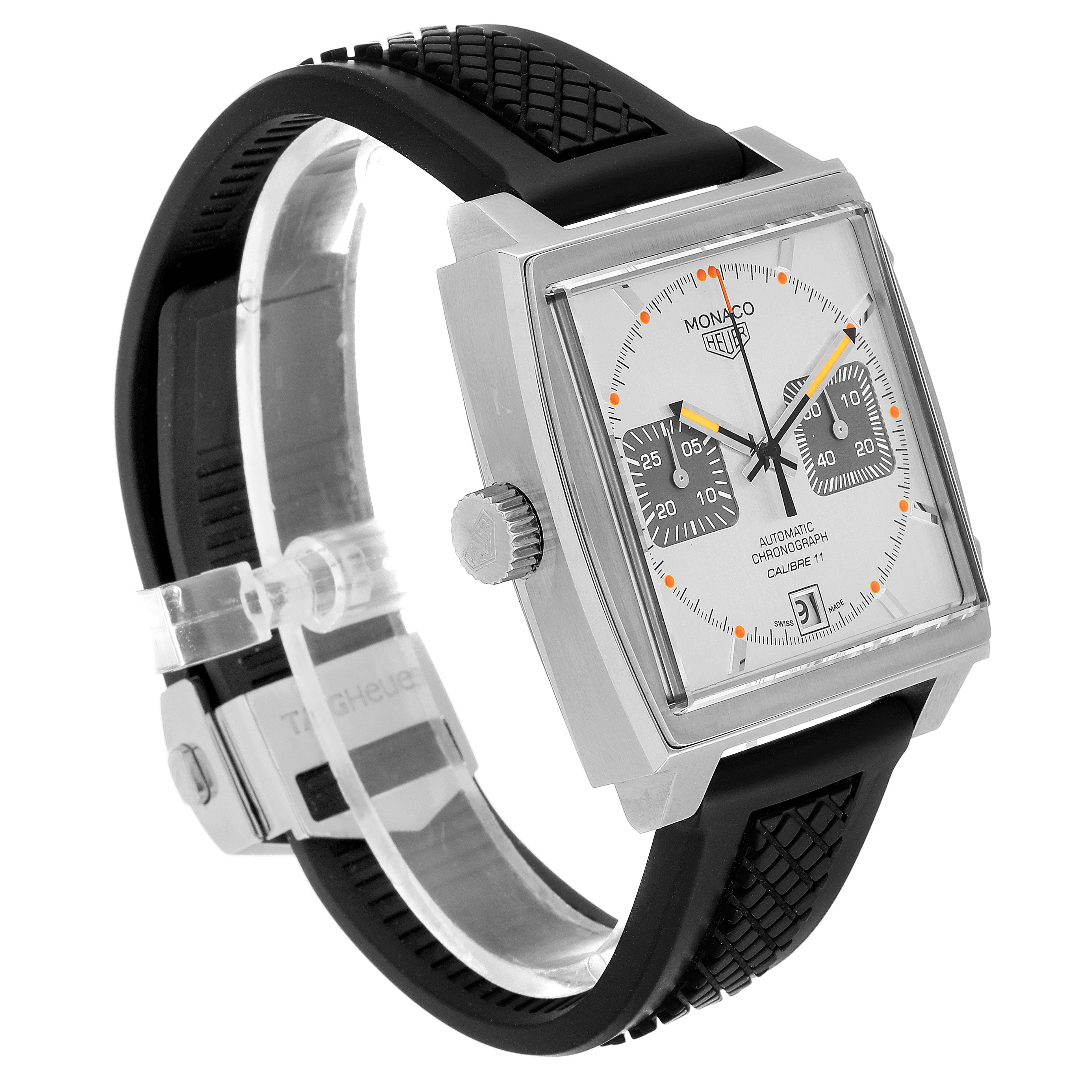 This image shows a Tag Heuer Monaco watch from a side angle, highlighting its square face, crown, and black strap.