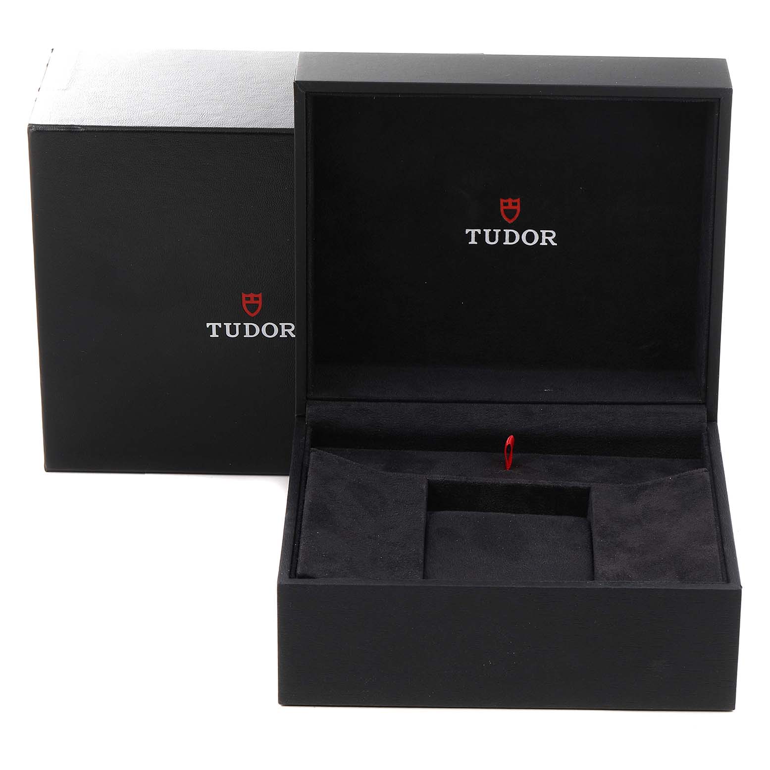 The image shows an open black Tudor box for the Heritage Black Bay model, showcasing the inner compartment and branding.