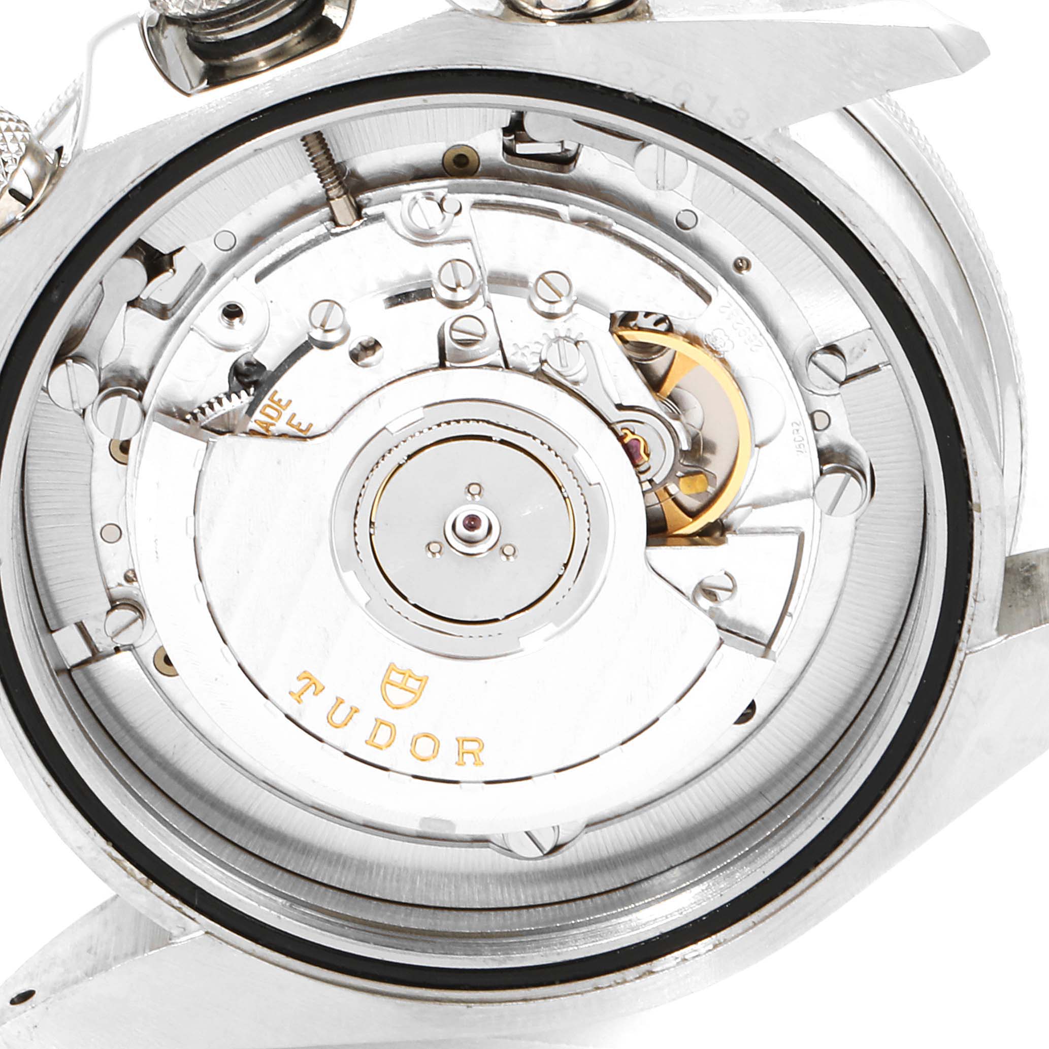 The image shows a close-up view of the movement and inner mechanics of the Tudor Heritage Chrono 70330B Men's Stainless Steel Blue Dial 70330B Men's Stainless Steel Blue Dial watch.