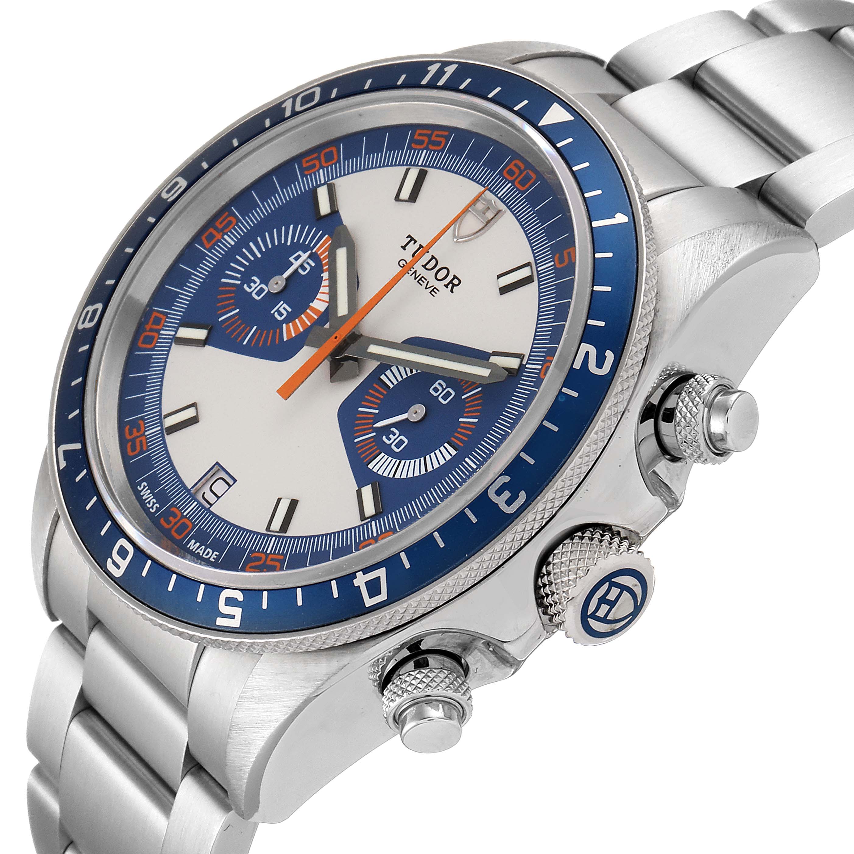The image shows a side-angle view of the Tudor Heritage Chrono 70330B Men's Stainless Steel Blue Dial 70330B Men's Stainless Steel Blue Dial watch, highlighting the dial, bezel, bracelet, and crown.