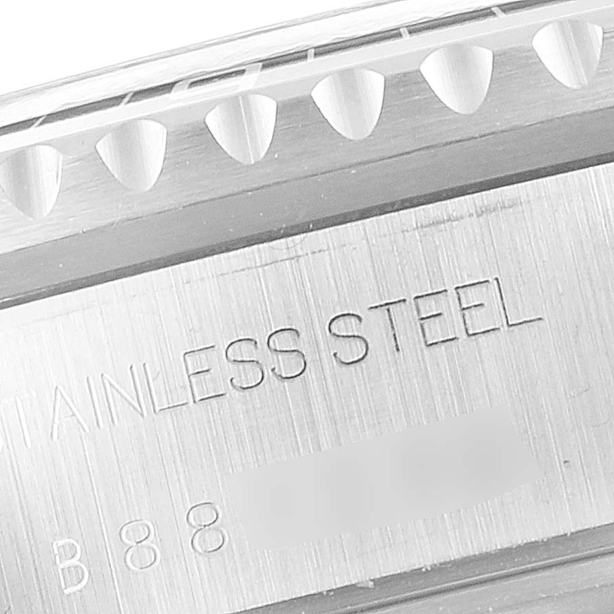 This image shows a close-up of the side of a Tudor Tiger 79270 Men's Stainless Steel Burgundy Dial 79270 Men's Stainless Steel Burgundy Dial model watch, highlighting the stainless steel engraving and a portion of the bezel.