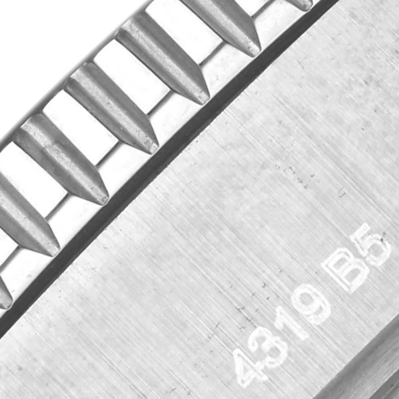 The image showcases a close-up of the textured bezel edge and case side of a Breitling Superocean A17367021I1A1 Men's Stainless Steel Yellow Dial A17367021I1A1 Men's Stainless Steel Yellow Dial watch.