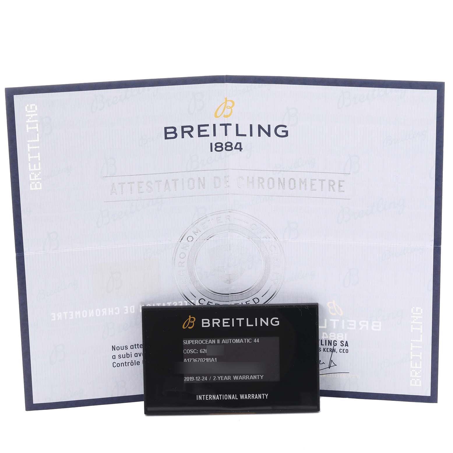The image shows a Breitling Superocean A17367021I1A1 Men's Stainless Steel Yellow Dial A17367021I1A1 Men's Stainless Steel Yellow Dial model's warranty card and chronometer certificate.