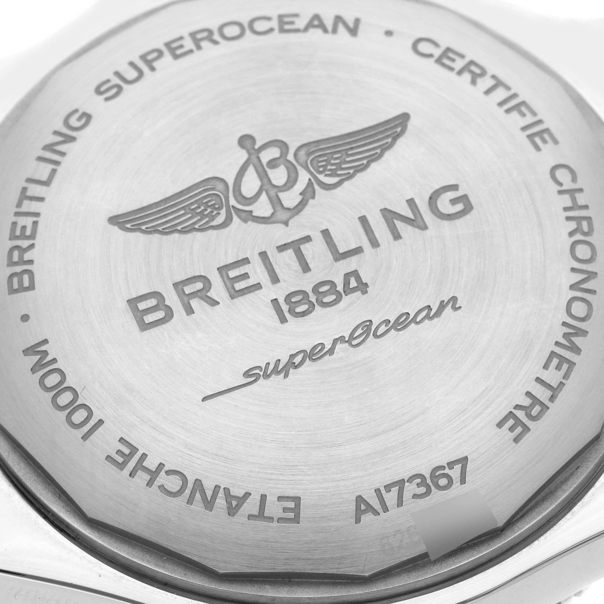 The image shows the back cover of a Breitling Superocean A17367021I1A1 Men's Stainless Steel Yellow Dial A17367021I1A1 Men's Stainless Steel Yellow Dial watch, highlighting brand engravings and model details.