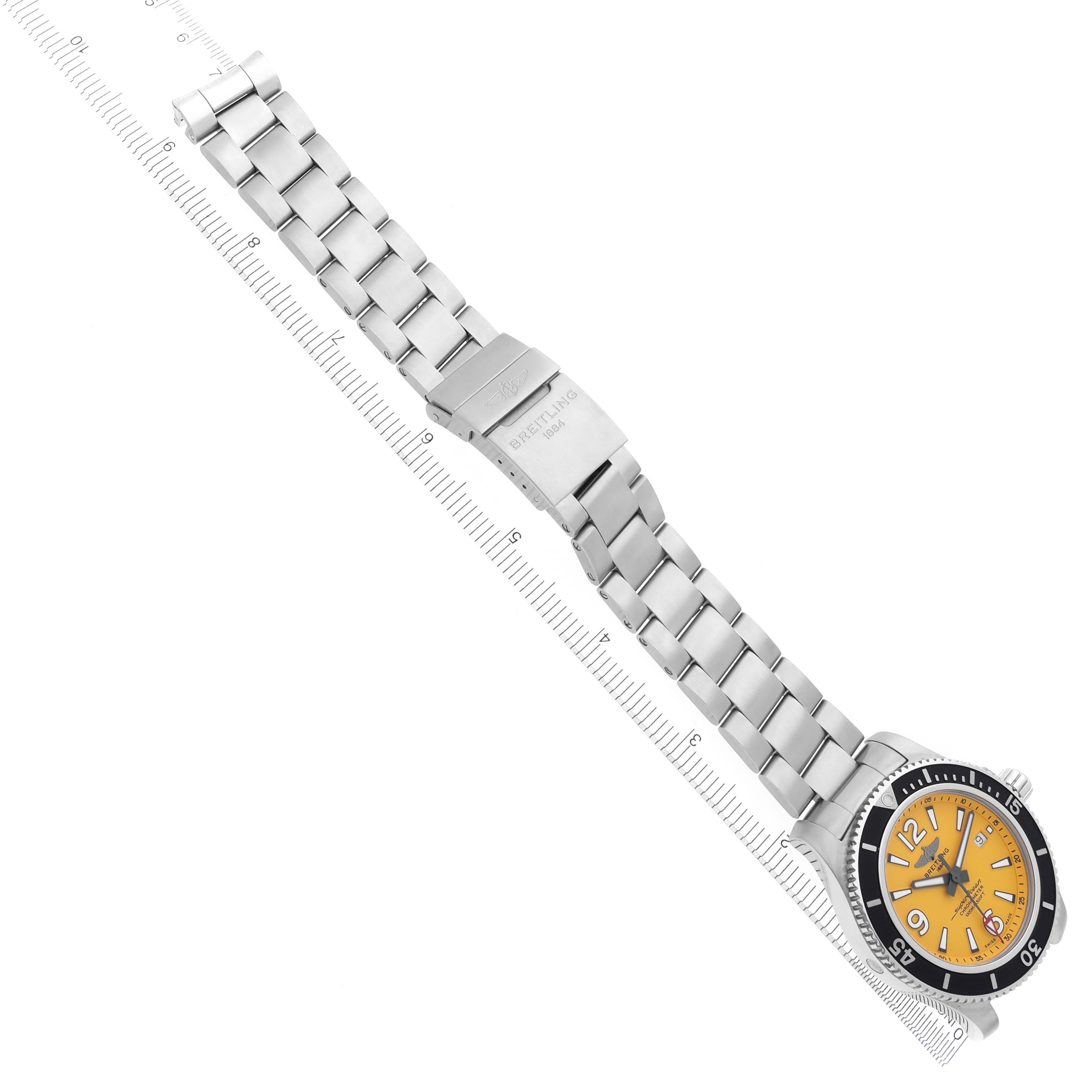 The Breitling Superocean A17367021I1A1 Men's Stainless Steel Yellow Dial A17367021I1A1 Men's Stainless Steel Yellow Dial watch is displayed in a top-down angle, showing its yellow dial, bezel, and full metal bracelet with clasp.