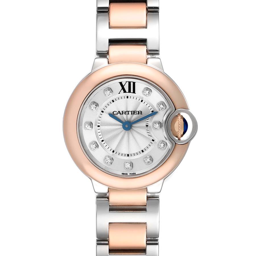 The Cartier Ballon Bleu watch is shown from a top view, displaying the face, Roman numeral hour markers, and bracelet.