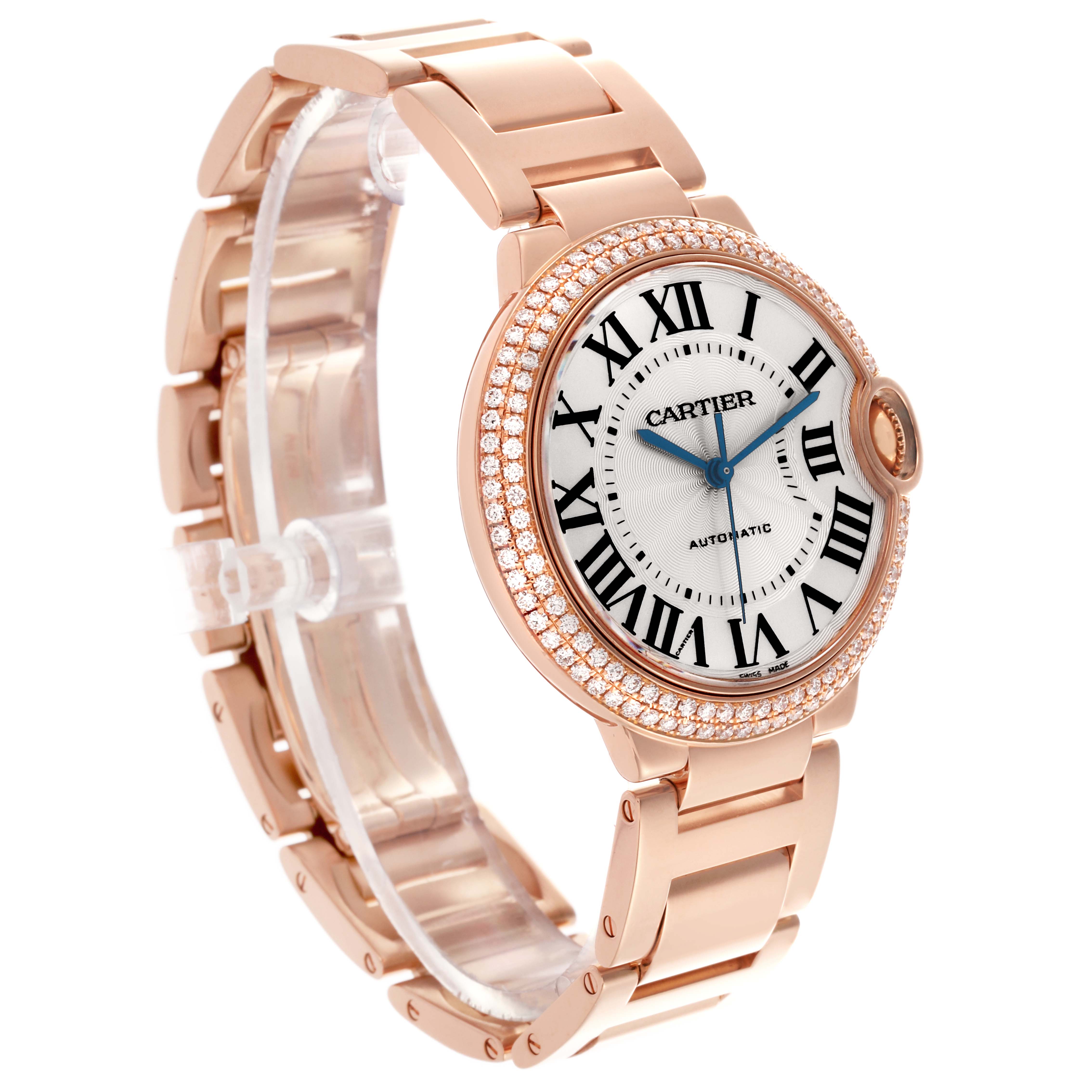 The Cartier Ballon Bleu WE9005Z3 Women
s Rose Gold Silver Dial WE9005Z3 Women
s Rose Gold Silver Dial watch is shown at a three-quarter angle, highlighting its rose gold case, bracelet, and diamond-set bezel.