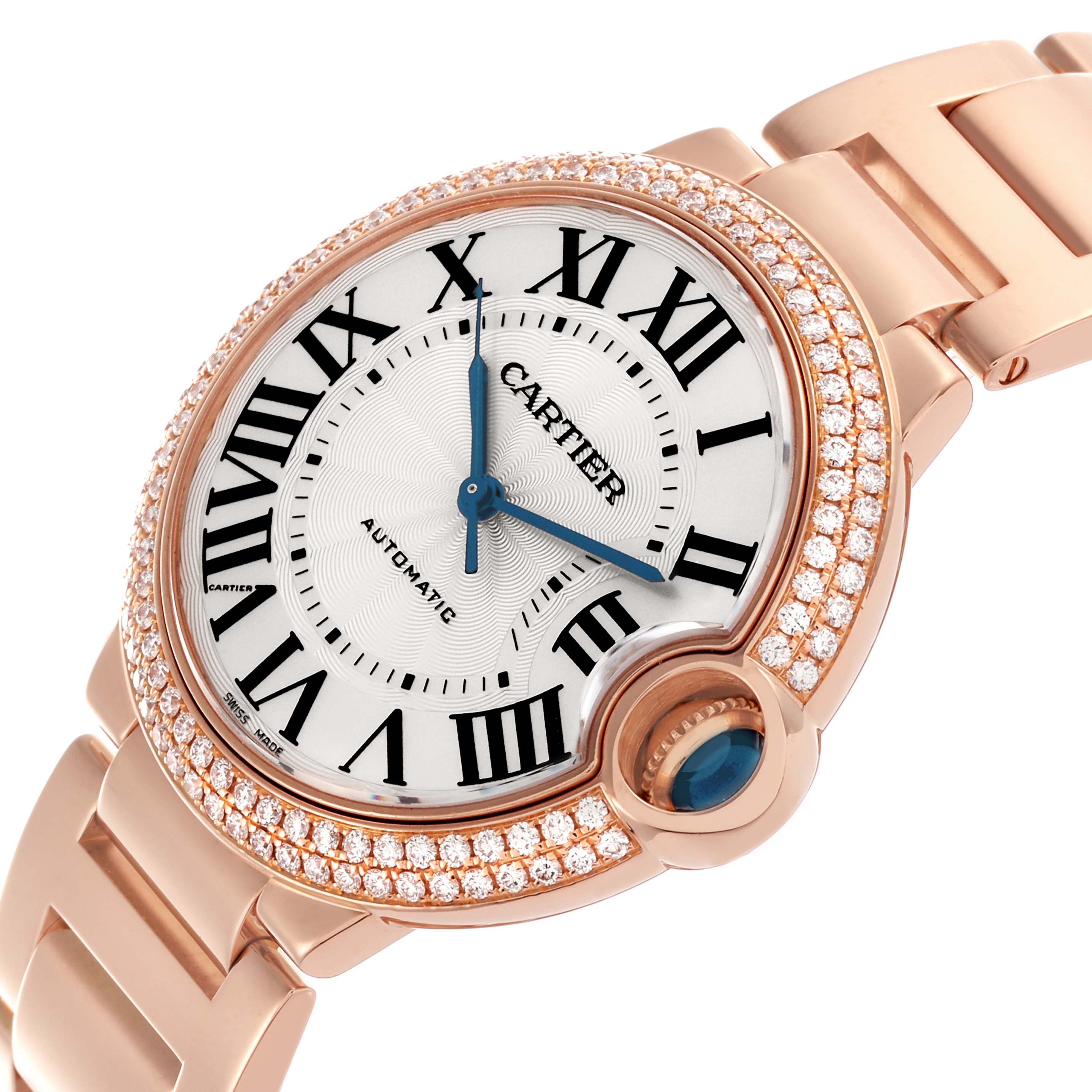The Cartier Ballon Bleu WE9005Z3 Women
s Rose Gold Silver Dial WE9005Z3 Women
s Rose Gold Silver Dial watch is shown at a slight angle, highlighting its diamond-studded bezel and blue cabochon crown.