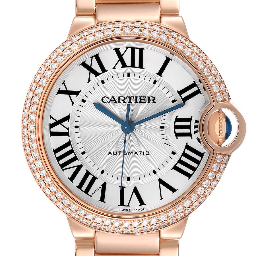 The Cartier Ballon Bleu watch is shown from a top-down angle, featuring the watch face, bezel, and part of the strap.