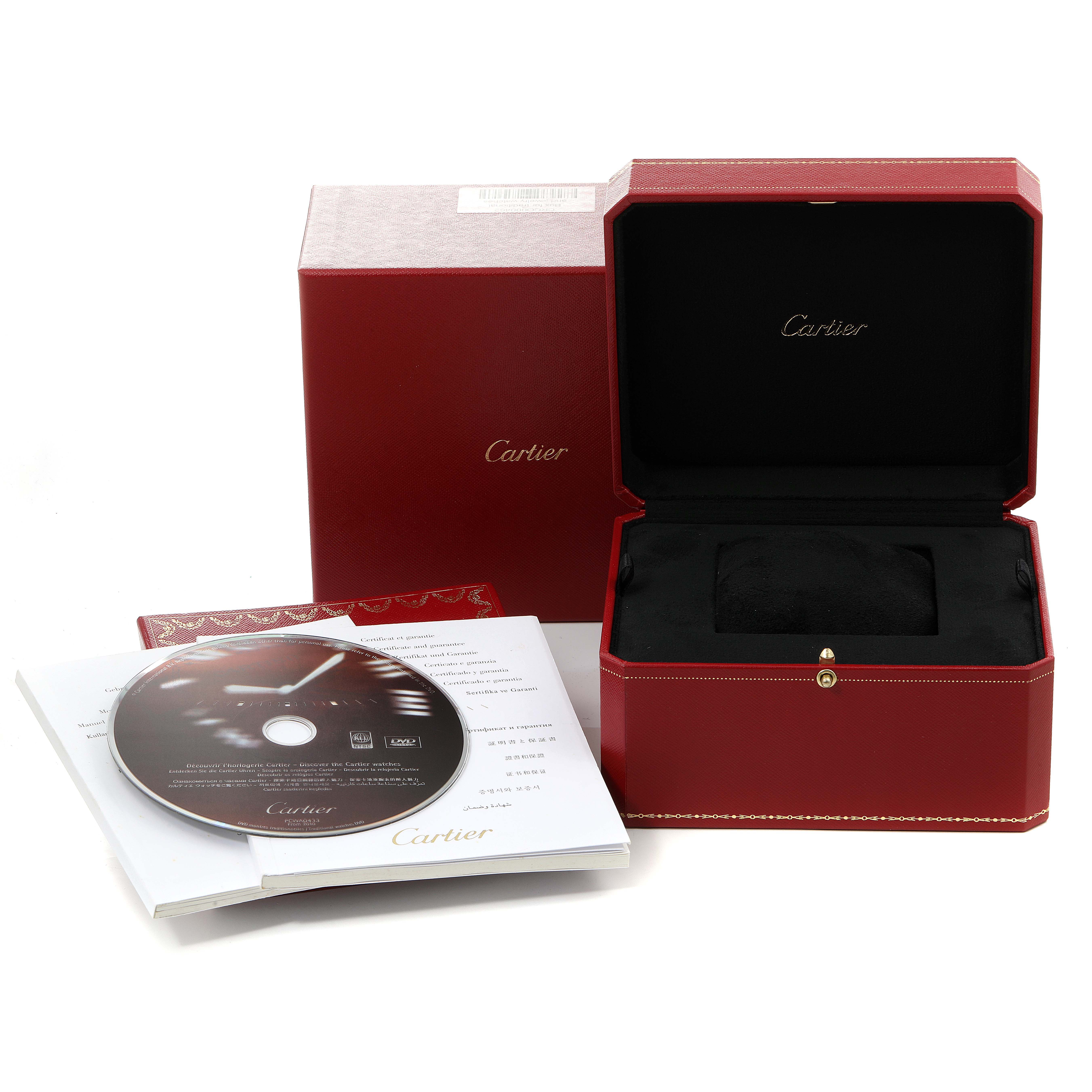The image shows the packaging and accessories of a Ballon Bleu de Cartier watch, including the box, booklet, and CD.