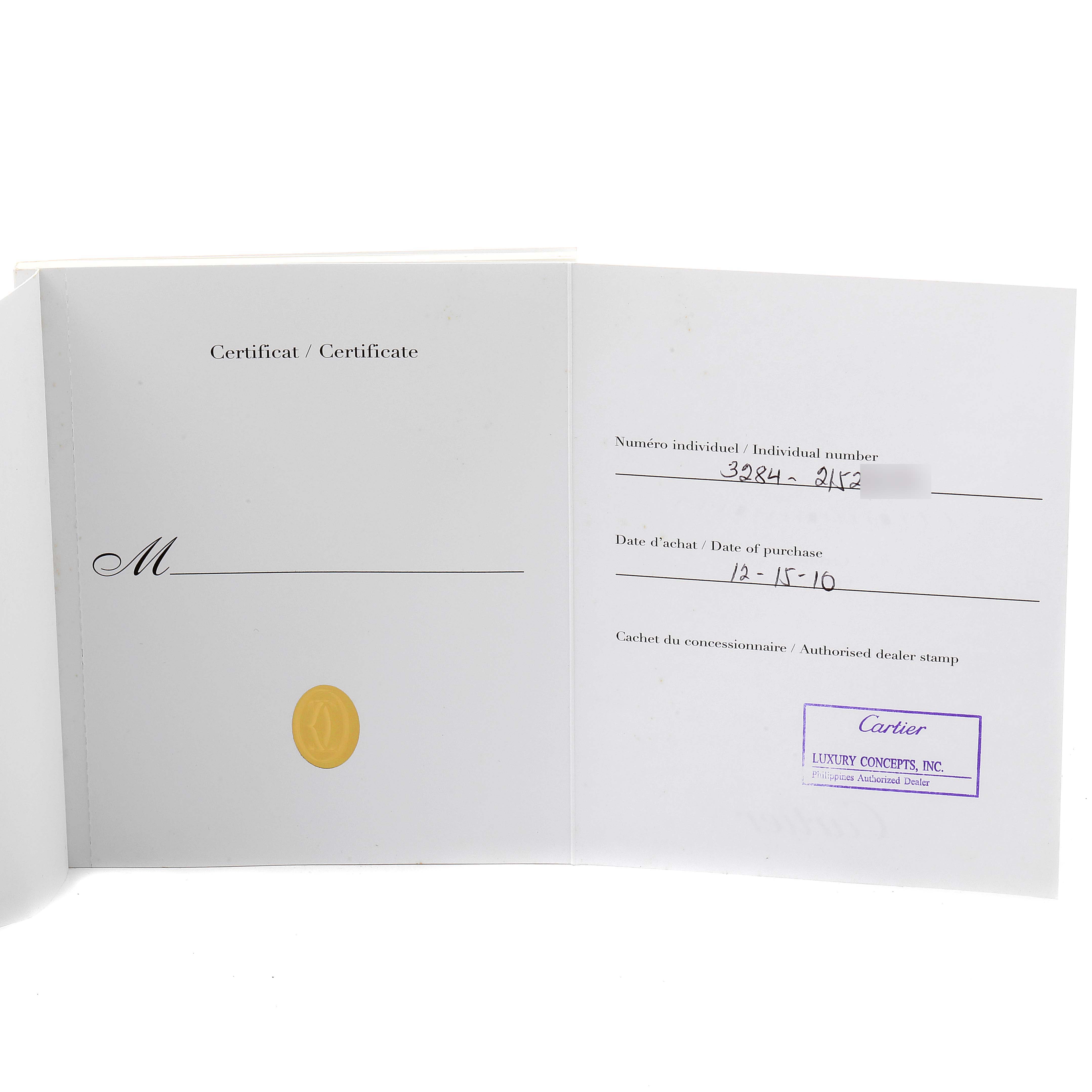 This image shows an open certificate booklet for the Ballon Bleu model by Cartier, displaying purchase details and dealer stamp.