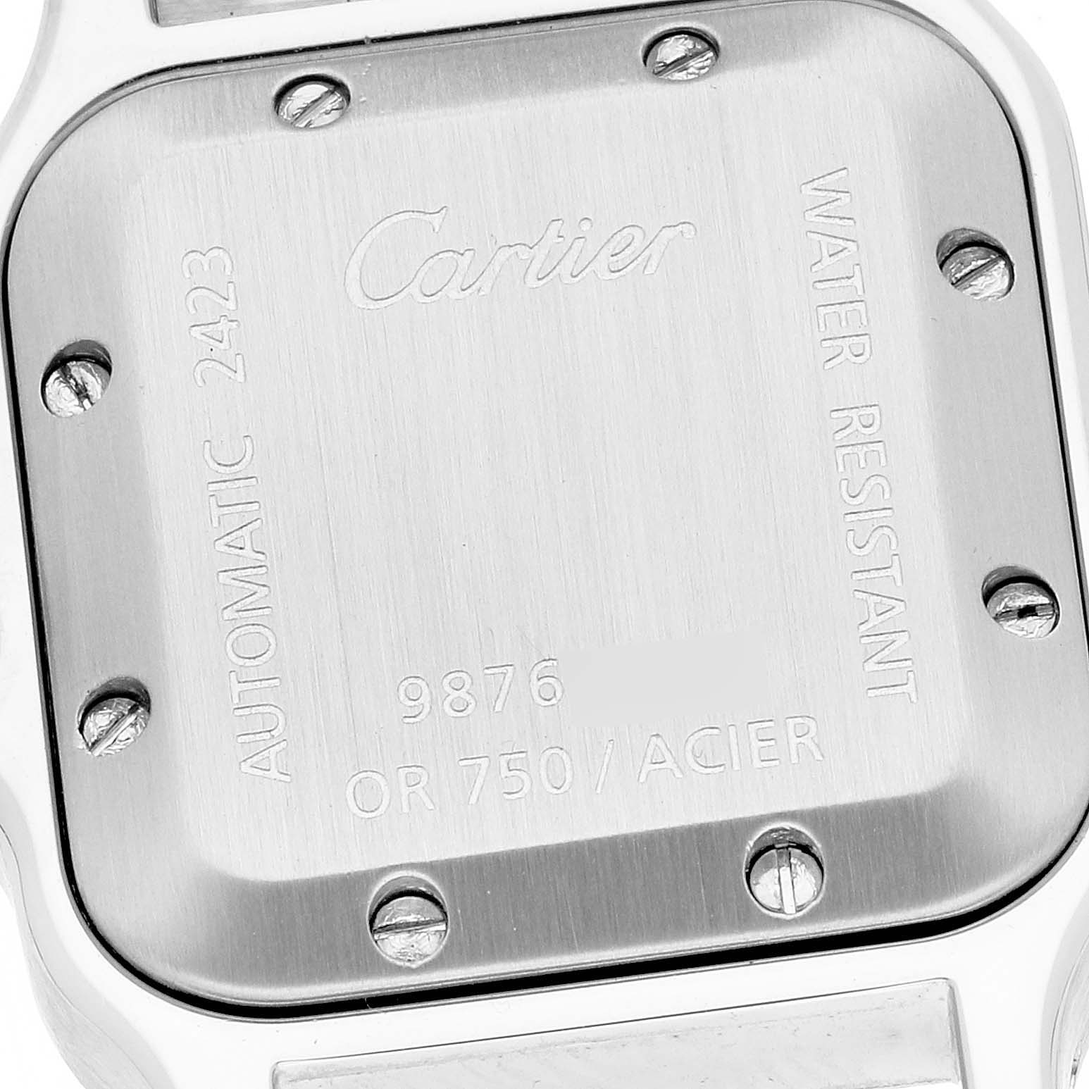 The image shows the back case of a Santos model watch by Cartier, highlighting the screws and engraved details.