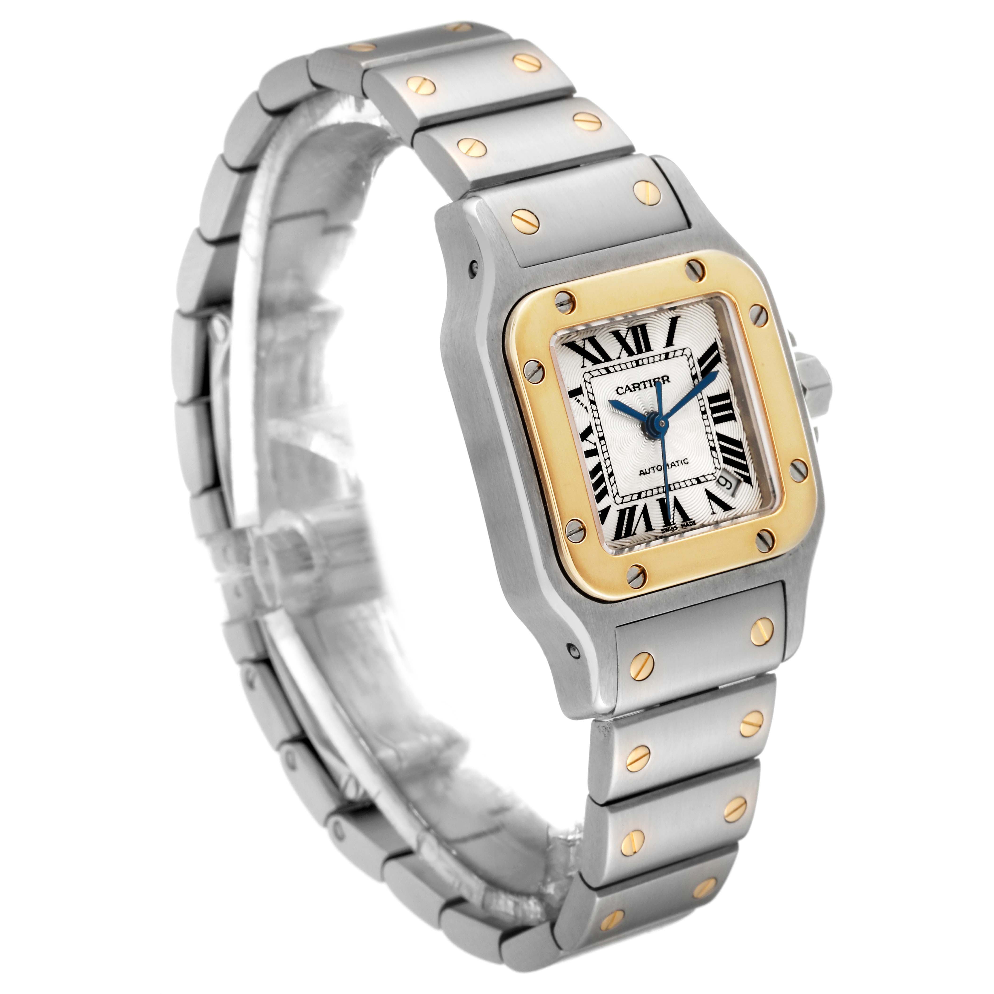The Cartier Santos W20057C4 Women's Steel and Gold (two tone) Silver Dial W20057C4 Women's Steel and Gold (two tone) Silver Dial model watch is shown from an angled view, displaying its face, case, bezel, and part of the bracelet.