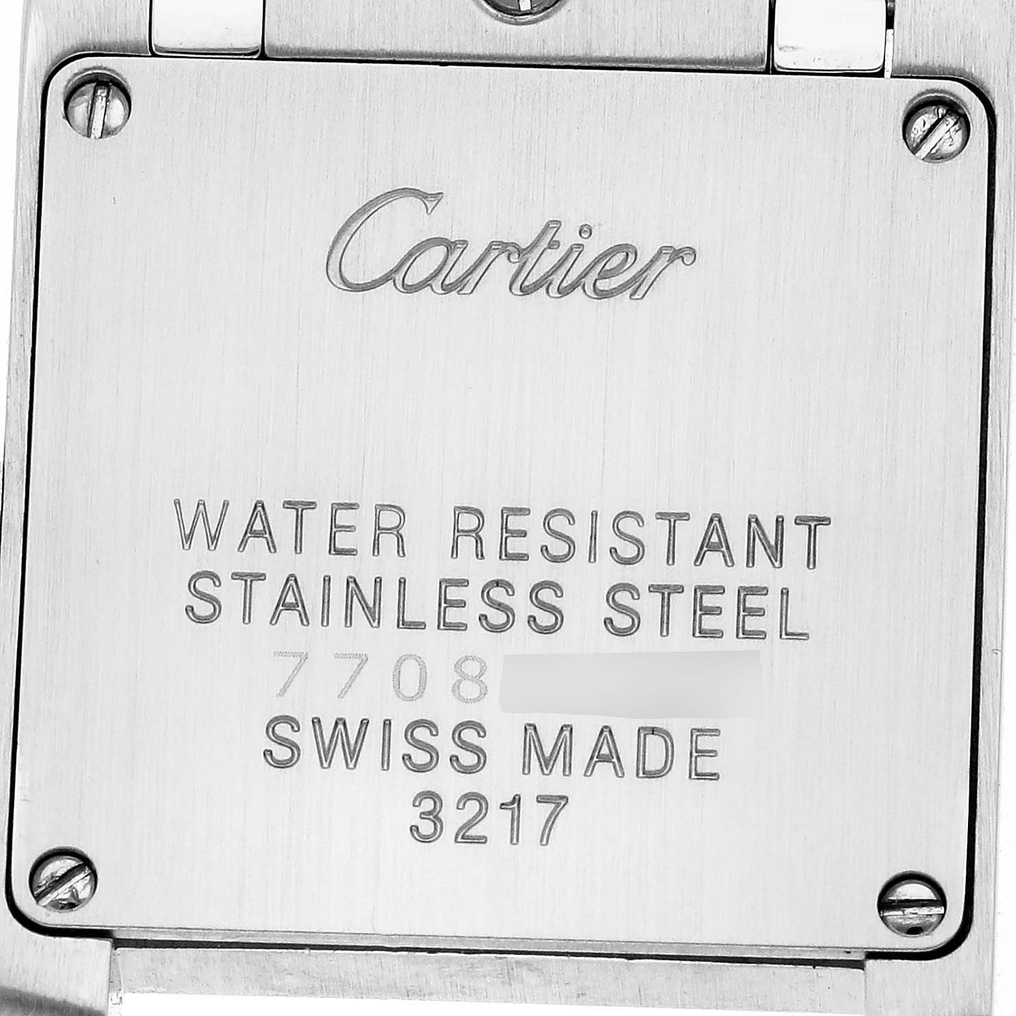 This image shows the back of the Cartier Tank Française watch, highlighting its stainless steel construction and engravings.