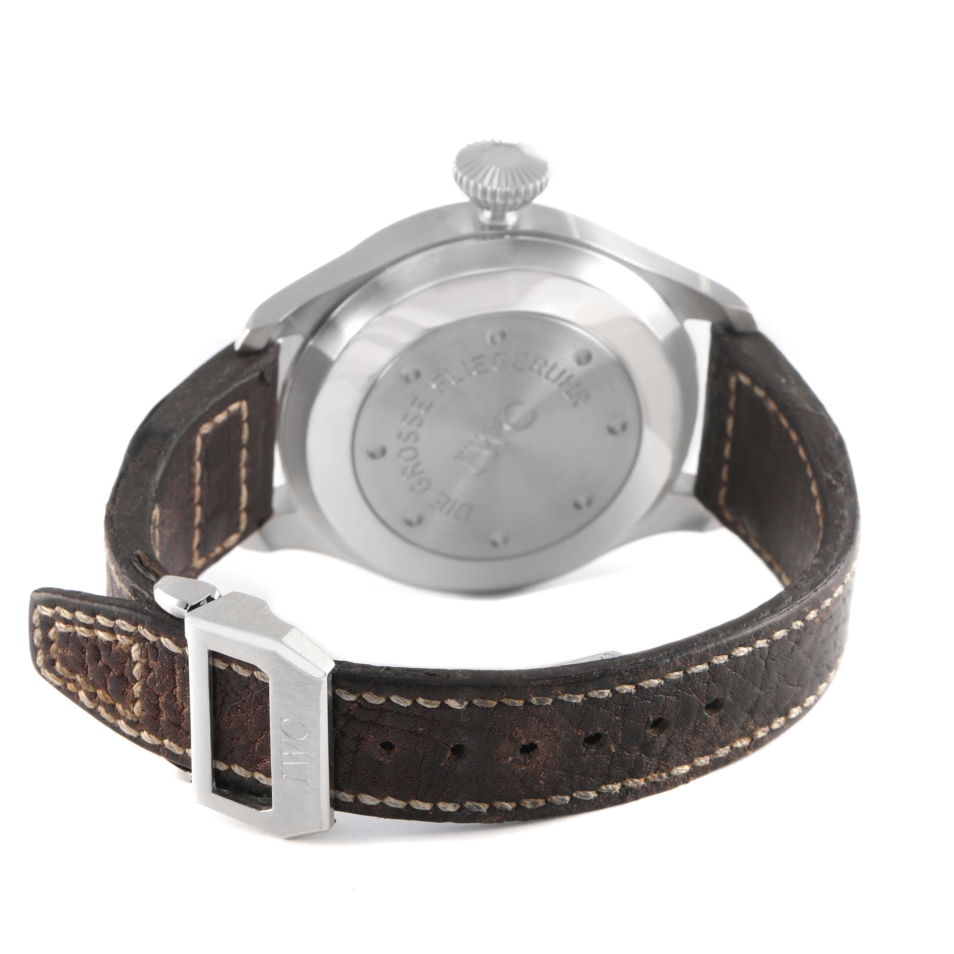 The IWC Pilot IW500201 Men's Stainless Steel Black Dial watch is shown from a rear angle, highlighting the case back, crown, and leather strap with buckle.