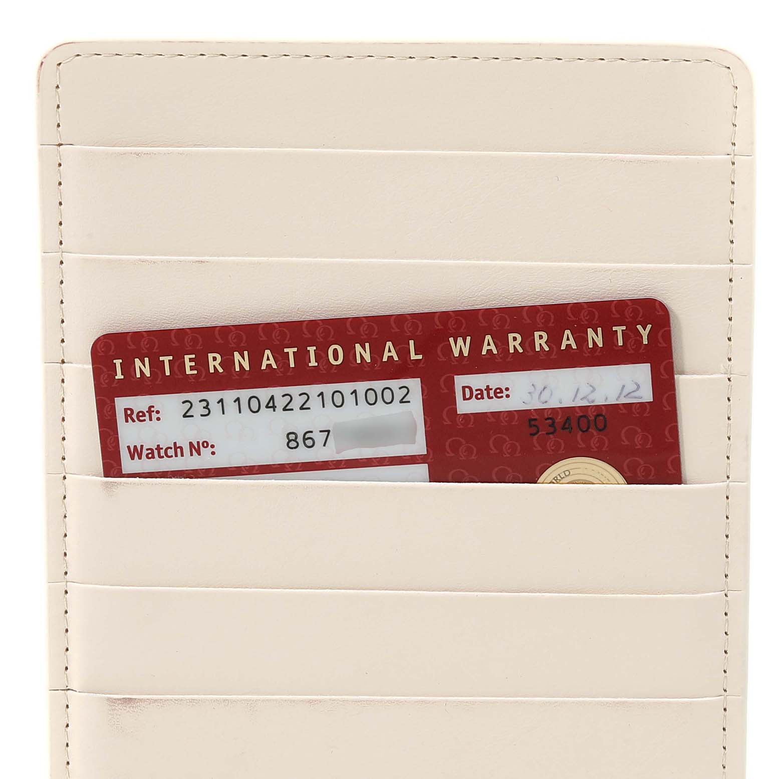 The image shows an Omega Aqua Terra 231.10.42.21.01.002 Men's Stainless Steel Black Dial 231.10.42.21.01.002 Men's Stainless Steel Black Dial model's international warranty card in a beige cardholder.