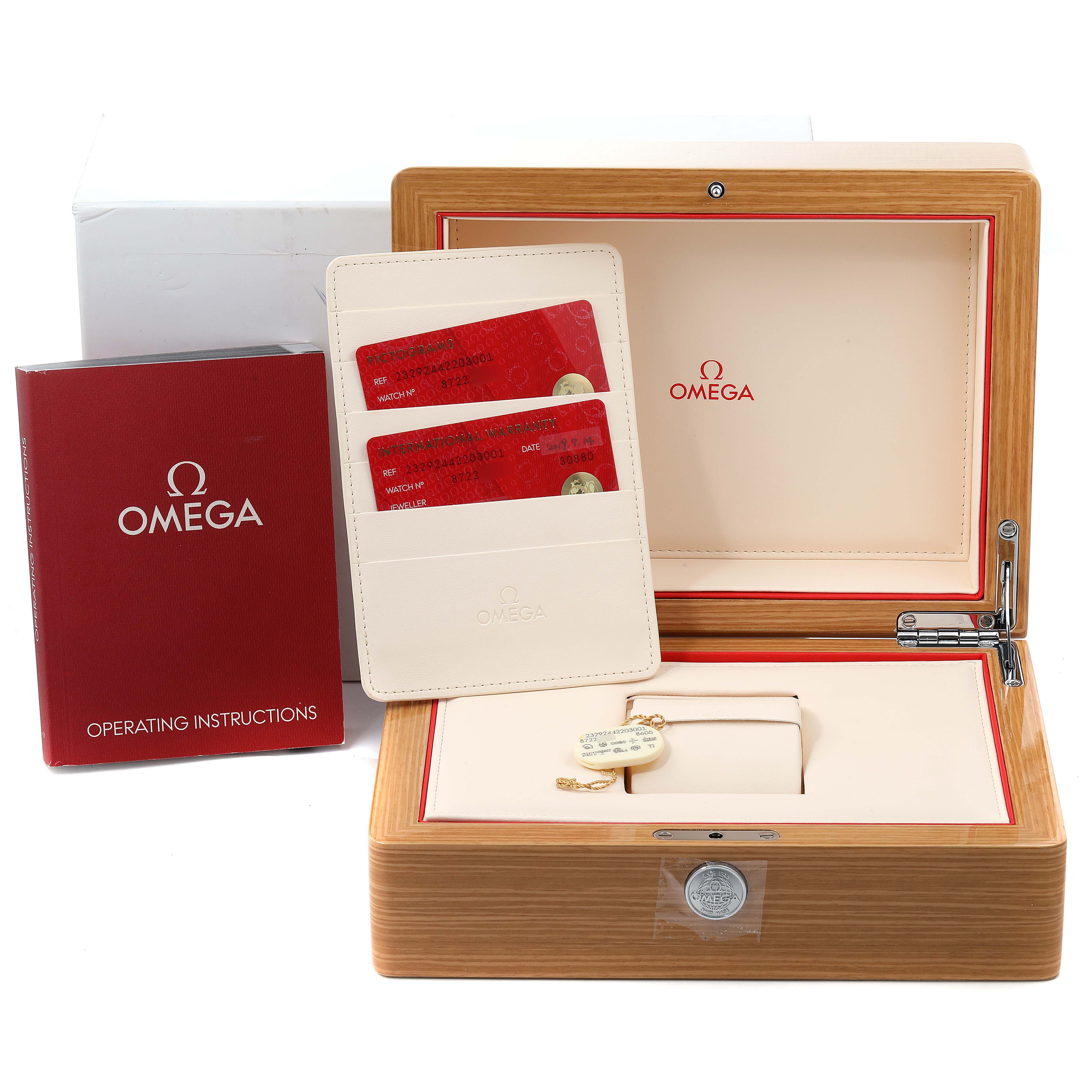 The image shows the Omega Planet Ocean 232.92.44.22.03.001 Men's Stainless Steel Blue Dial 232.92.44.22.03.001 Men's Stainless Steel Blue Dial watch packaging with the instruction manual, warranty cards, and a wooden box.