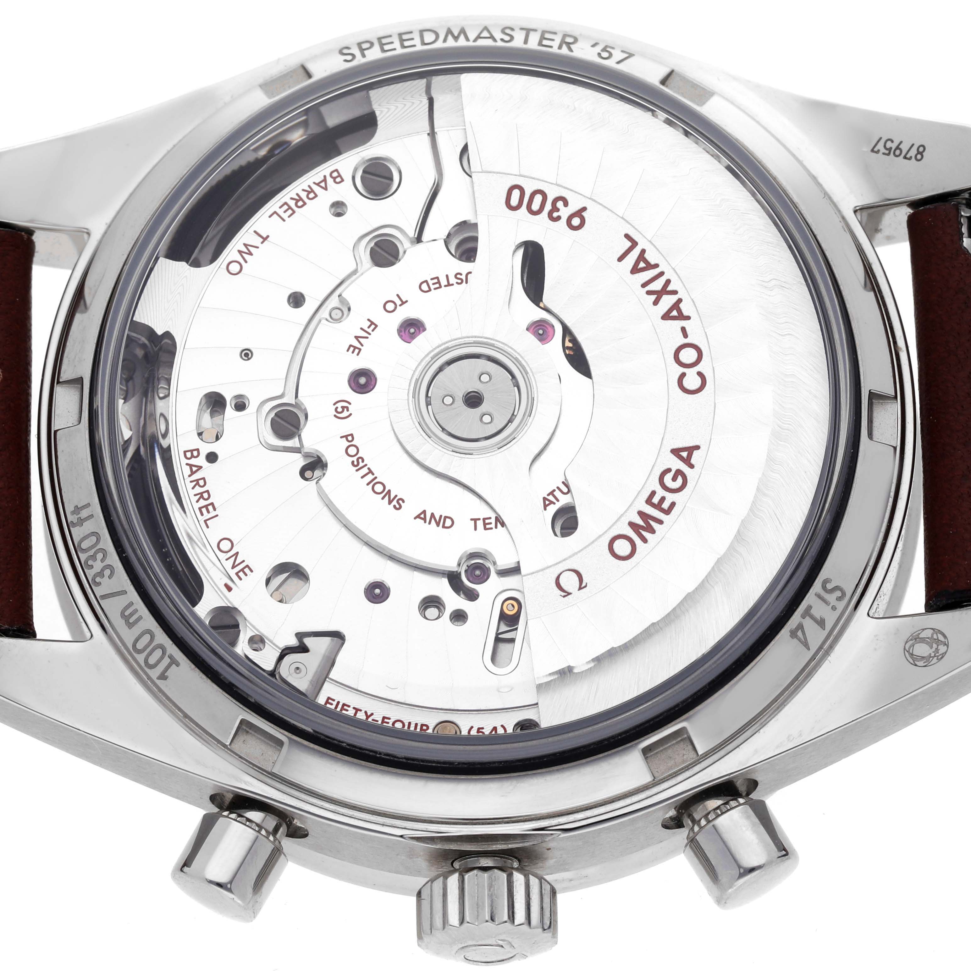 The image shows the back of an Omega Speedmaster '57 watch, featuring its Co-Axial movement and detailing.