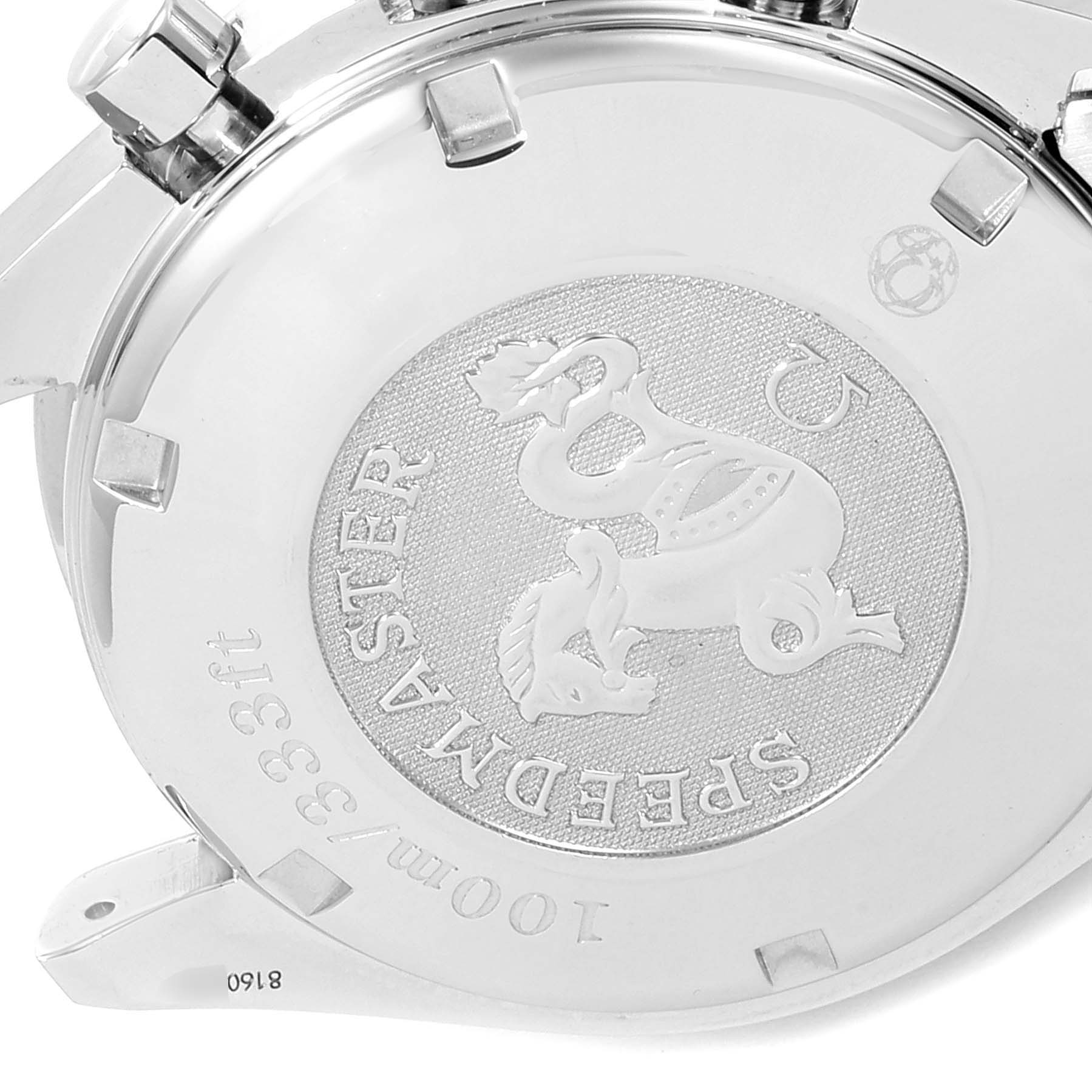 The image shows the case back of an Omega Speedmaster 3212.80.00 Men
s Stainless Steel Blue Dial 3212.80.00 Men
s Stainless Steel Blue Dial watch, featuring an embossed emblem and text.