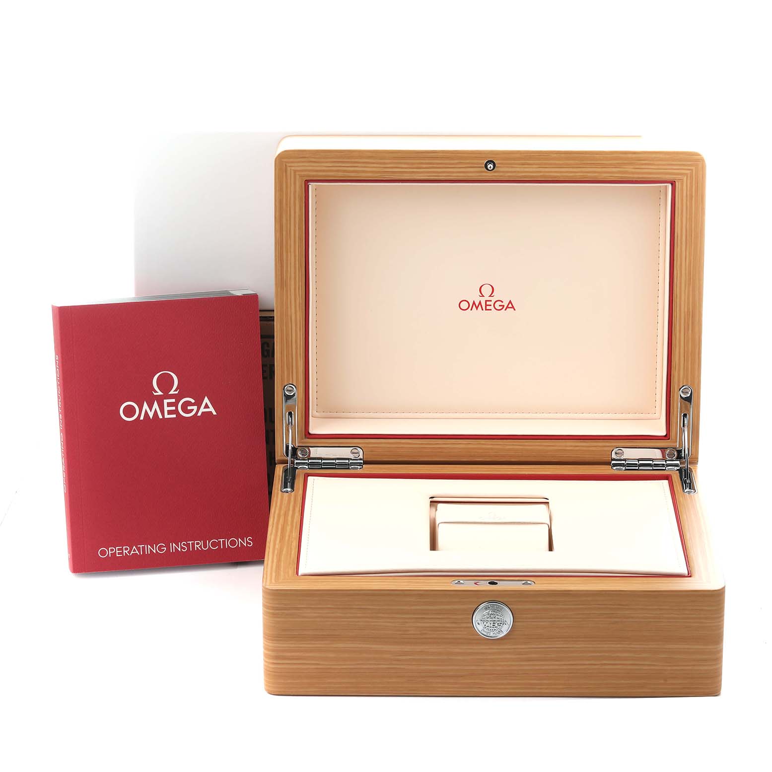 The image shows an Omega Speedmaster 323.30.40.40.04.001 Men's Stainless Steel White Dial 323.30.40.40.04.001 Men's Stainless Steel White Dial watch box open, with operating instructions beside it.