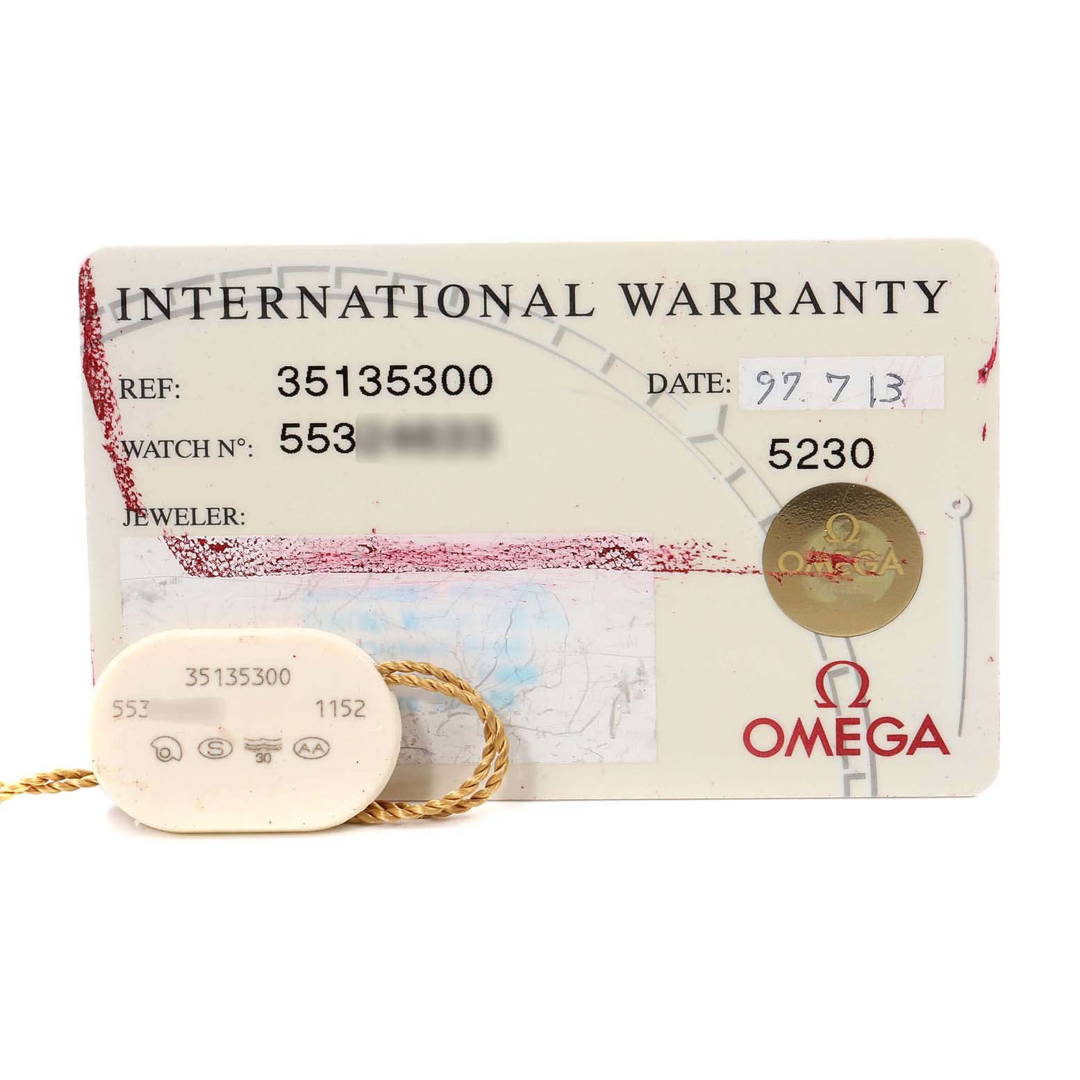 The image shows the international warranty card and a hang tag for the Omega Speedmaster 3513.53.00 Men
s Stainless Steel Black Dial 3513.53.00 Men
s Stainless Steel Black Dial watch model.