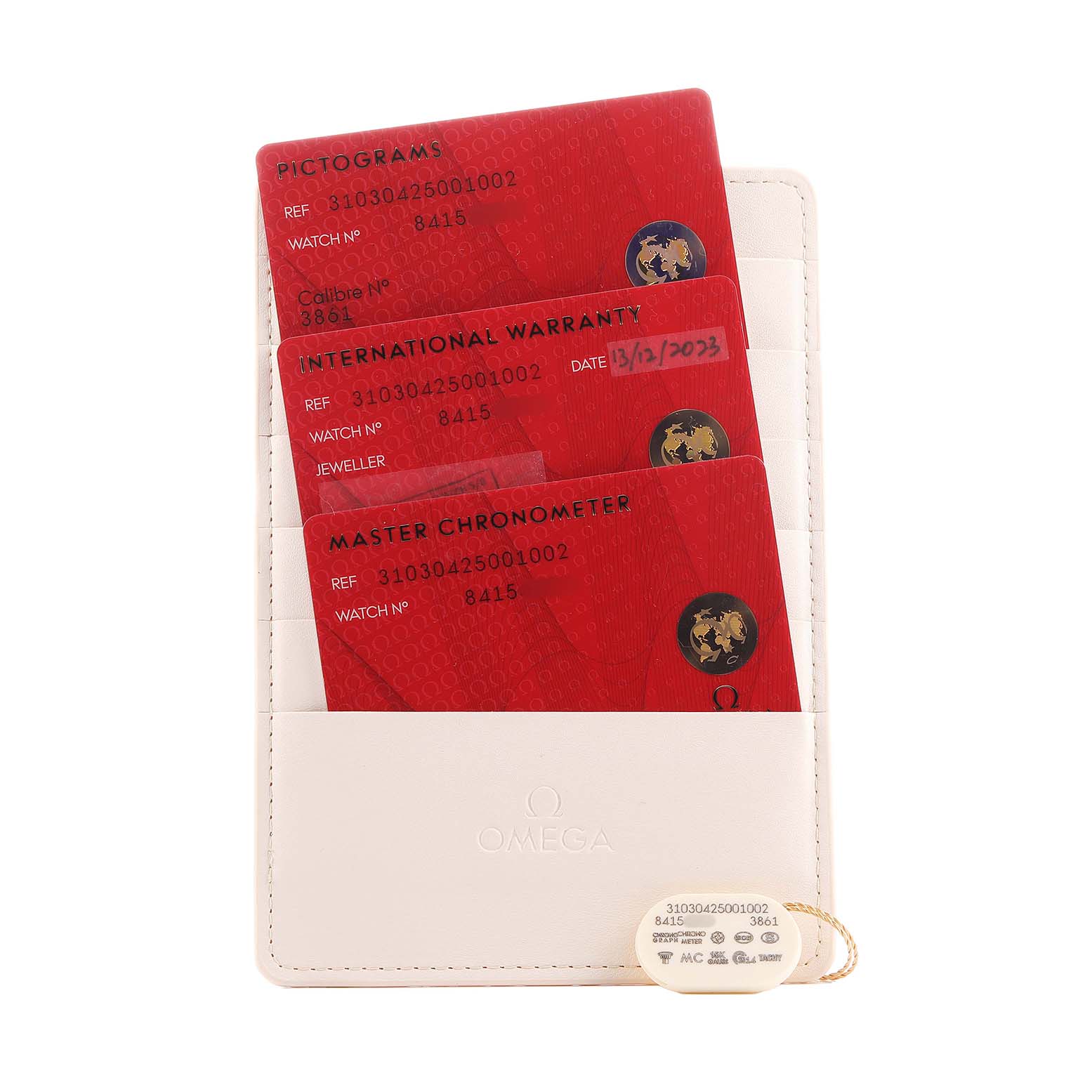 The image shows Omega Speedmaster 310.30.42.50.01.002 Men's Stainless Steel Black Dial watch warranty cards in a cream holder, viewed from above.