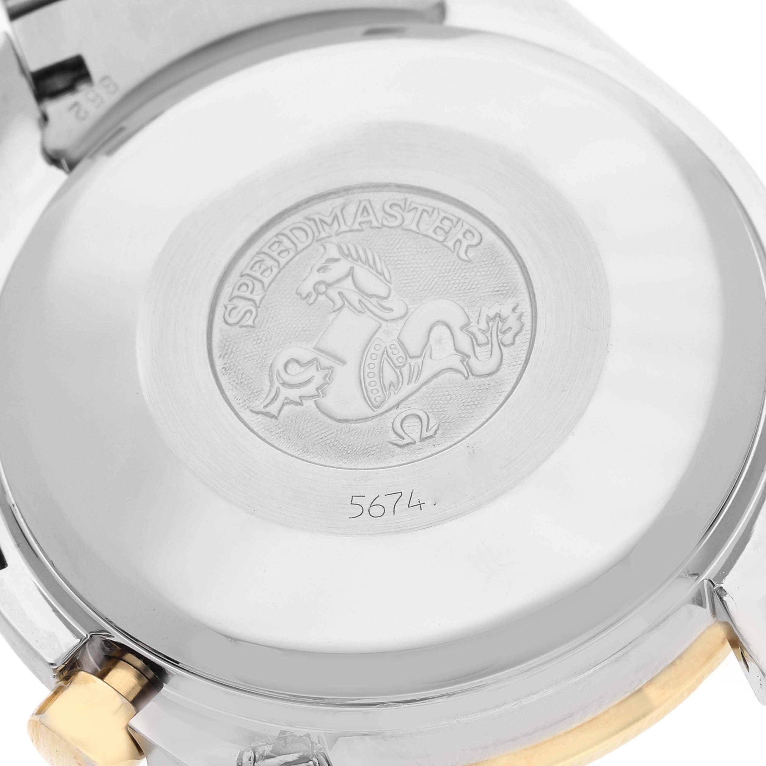 This image shows the case back of an Omega Speedmaster 3313.30.00 Men's Steel and Gold (two tone) Silver Dial 3313.30.00 Men's Steel and Gold (two tone) Silver Dial watch, highlighting the engraved logo and model name.