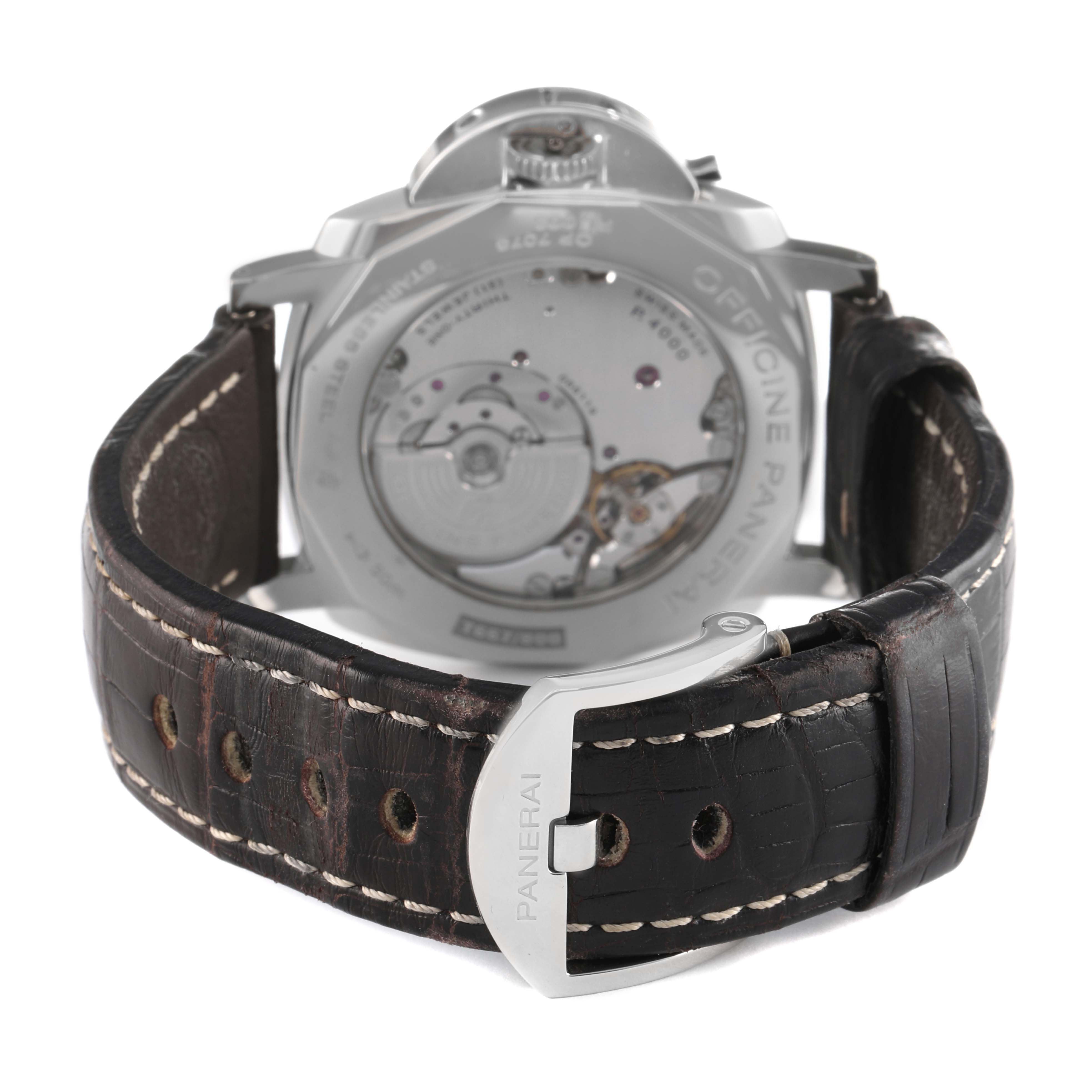 The image shows the back of a Panerai Luminor Due PAM00674 Men's Stainless Steel Black Dial watch, highlighting its movement and leather strap with a Panerai-branded buckle.