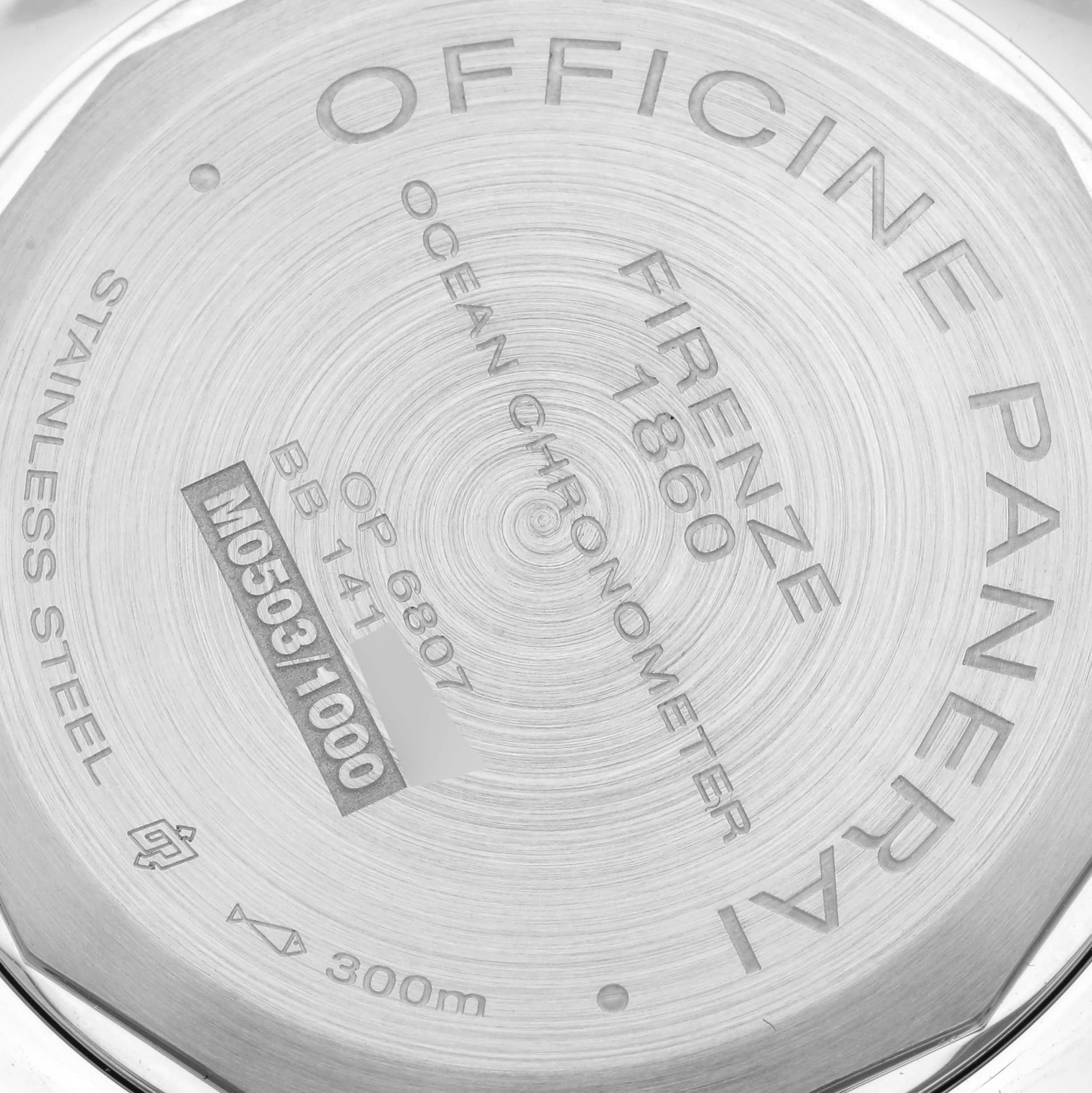 The image shows a close-up of the case back of a Panerai Luminor PAM00029 Men's Stainless Steel Black Dial PAM00029 Men's Stainless Steel Black Dial watch, displaying engravings and specifications.