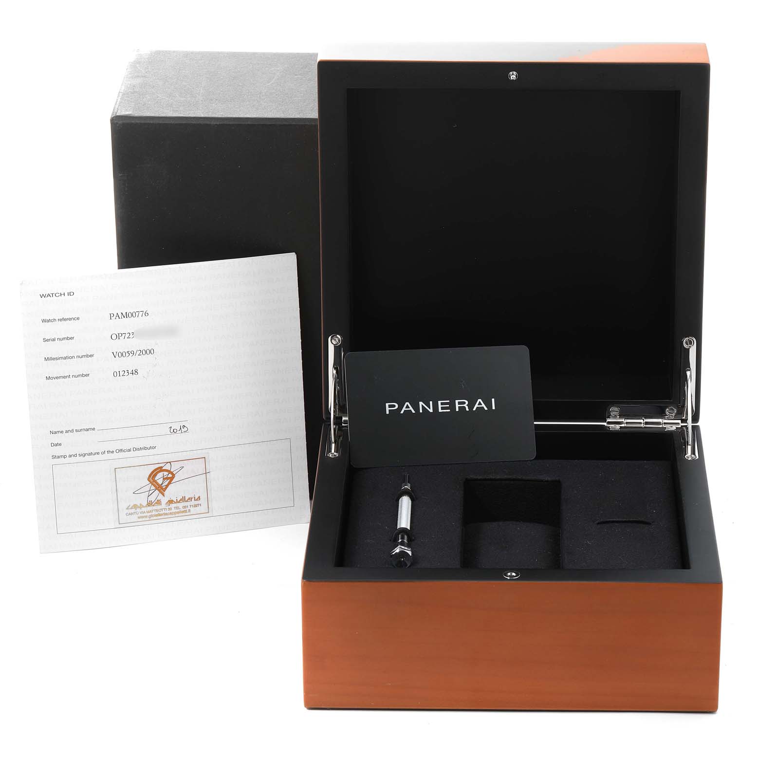 The image shows the open presentation box of a Panerai Luminor PAM00776 Men
s Stainless Steel Black Dial PAM00776 Men
s Stainless Steel Black Dial watch, with a card, document, and watch tool inside.