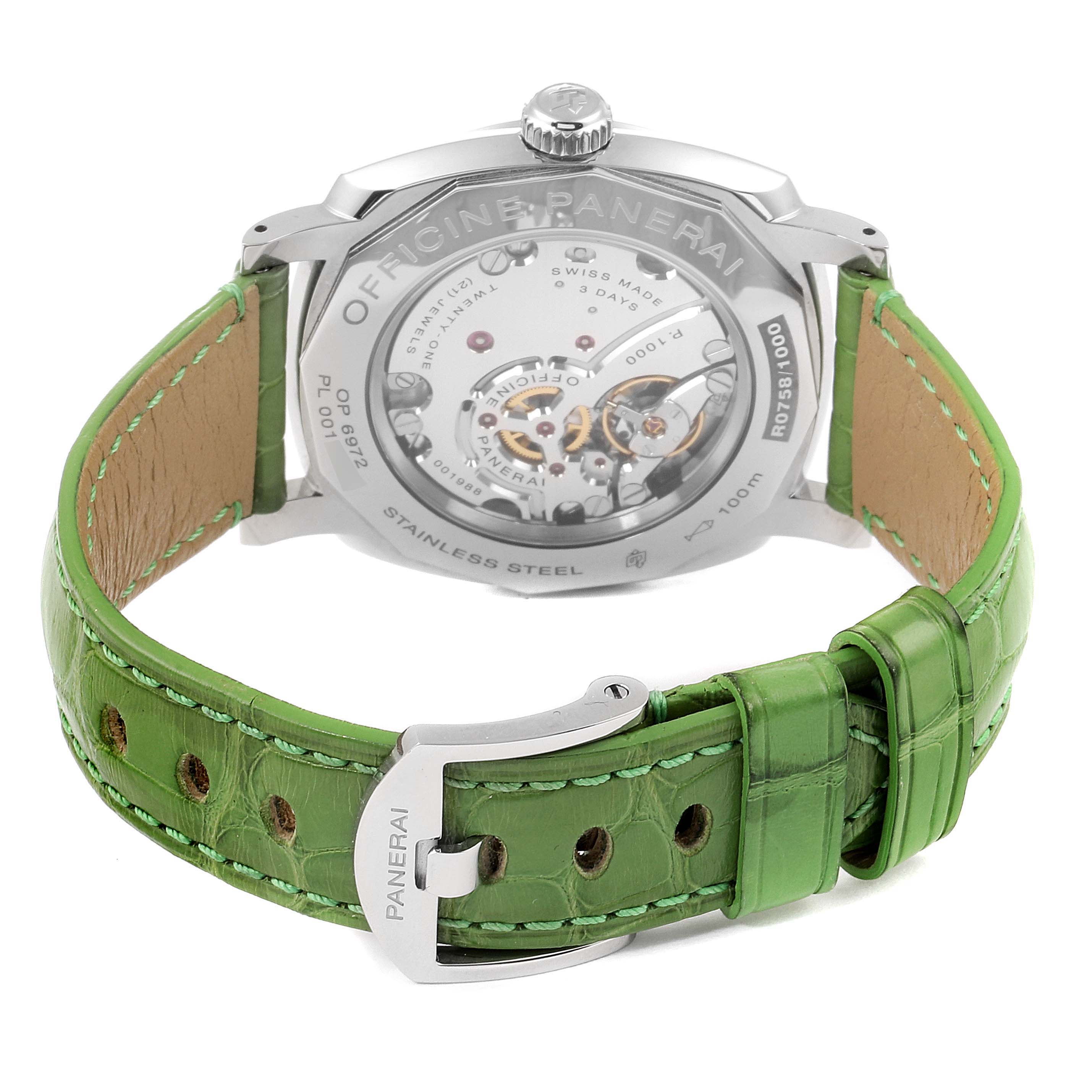 This Panerai Radiomir PAM00574 Men's Stainless Steel Black Dial PAM00574 Men's Stainless Steel Black Dial watch is shown from the back, highlighting its transparent case back and green leather strap.