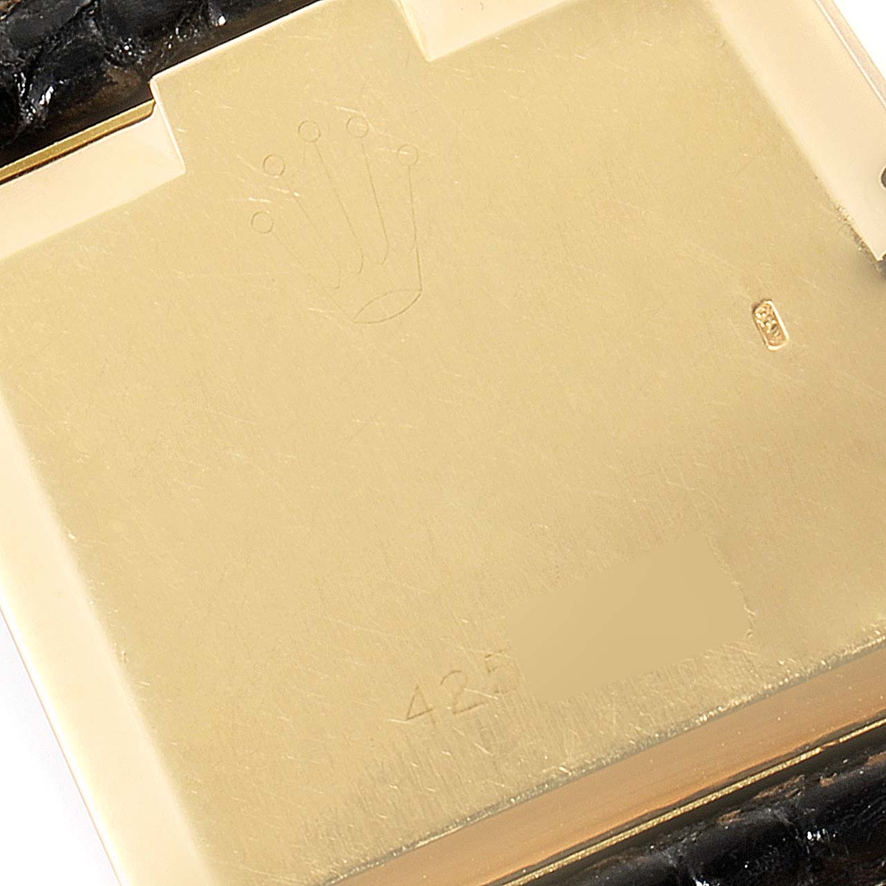 This image shows the back case of a Rolex Cellini 4031 Men's Yellow Gold Grey Dial 4031 Men's Yellow Gold Grey Dial watch, highlighting the brand's logo and serial number.