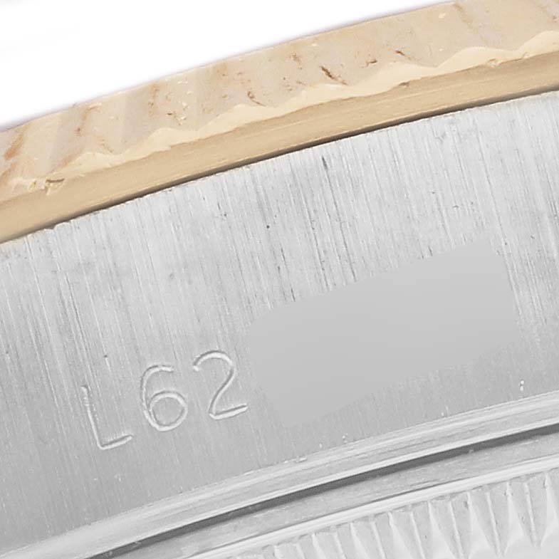 The image shows a close-up of the casing and edge of the bezel for a Rolex Datejust 69173 Women's Steel and Gold (two tone) White Dial 69173 Women's Steel and Gold (two tone) White Dial watch.