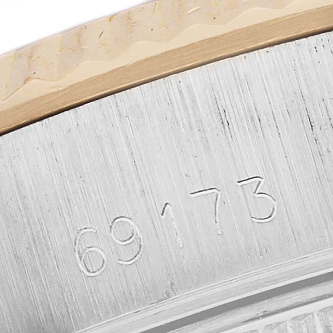 The image shows a close-up of the engraved model number on the side of a Rolex Datejust 69173 Women's Steel and Gold (two tone) White Dial 69173 Women's Steel and Gold (two tone) White Dial watch case.