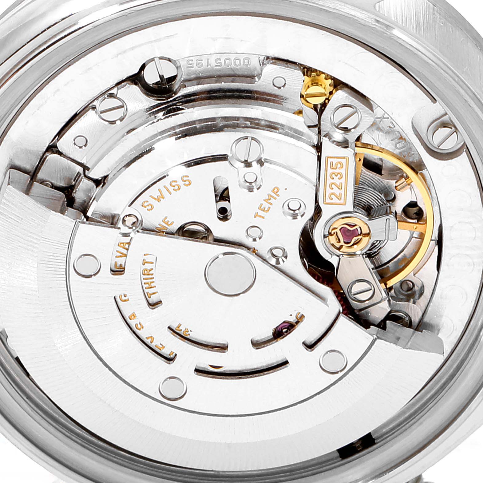 The image shows a close-up of the movement and internal mechanisms of a Mid-Size model Rolex watch.
