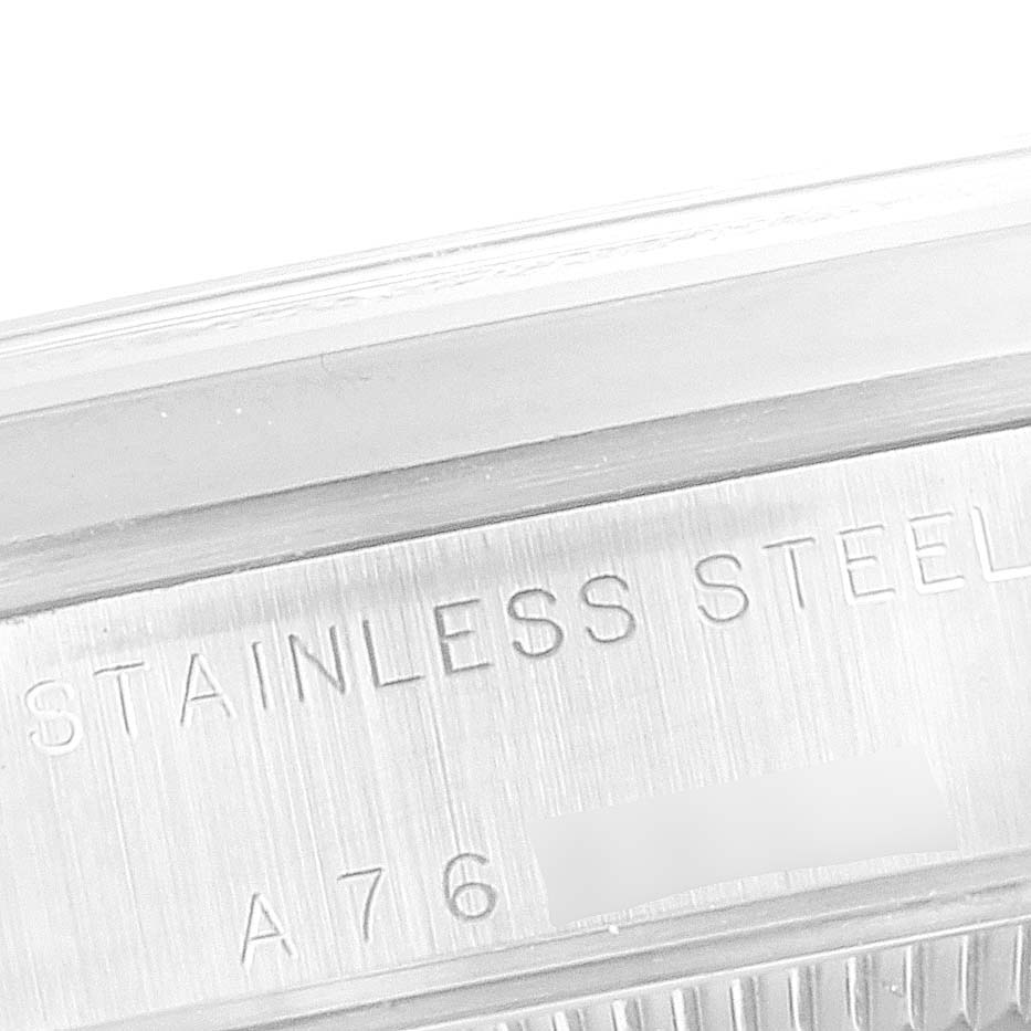 The image shows a close-up of the side of a Mid-Size Rolex watch case, featuring the "STAINLESS STEEL" engraving and part of the reference number.