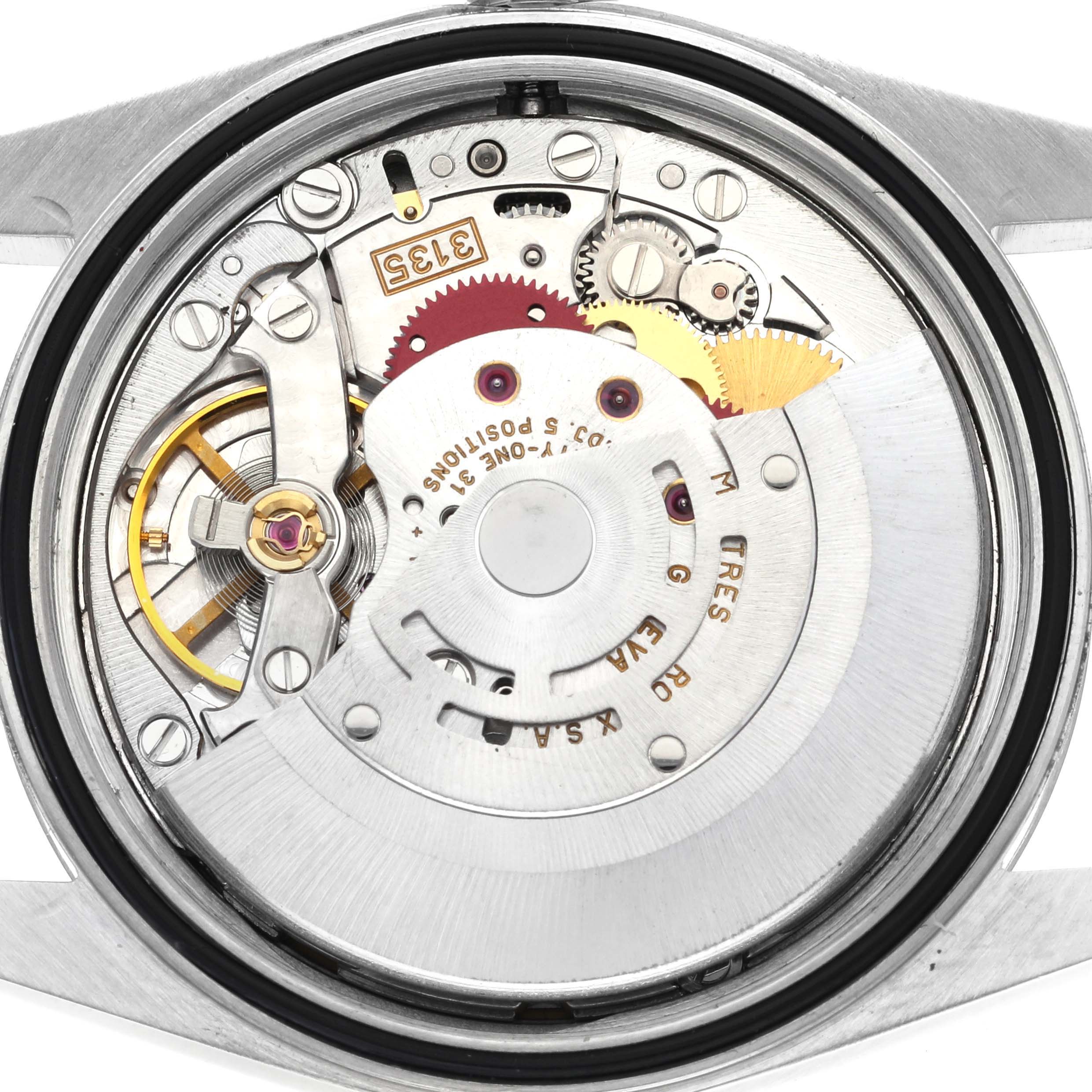 The image shows the movement and inner mechanisms of a Rolex Datejust 16234 Men
s Stainless Steel Blue Dial 16234 Men
s Stainless Steel Blue Dial watch from a back view.