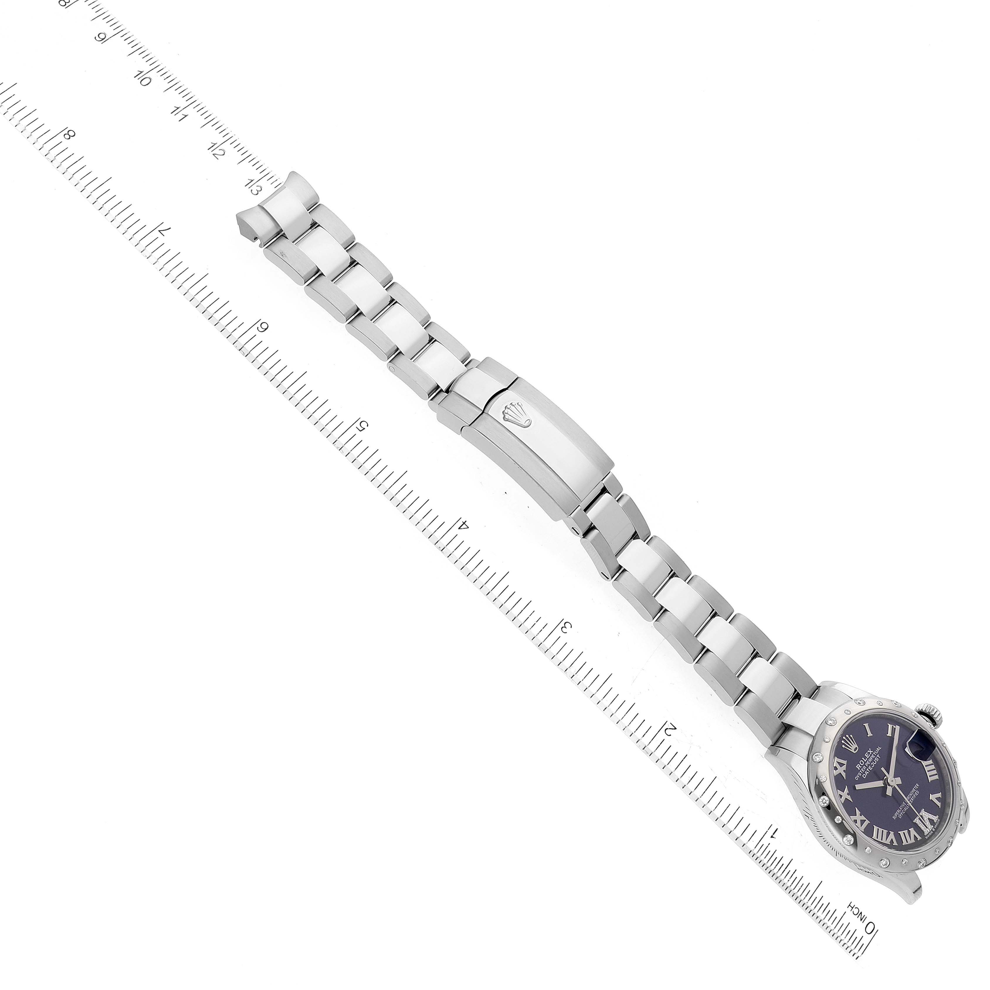 The image shows a Rolex Mid-Size 278344 Women's Stainless Steel Purple Dial 278344 Women's Stainless Steel Purple Dial watch laying flat with a visible face, bracelet, clasp, and a ruler for size reference.