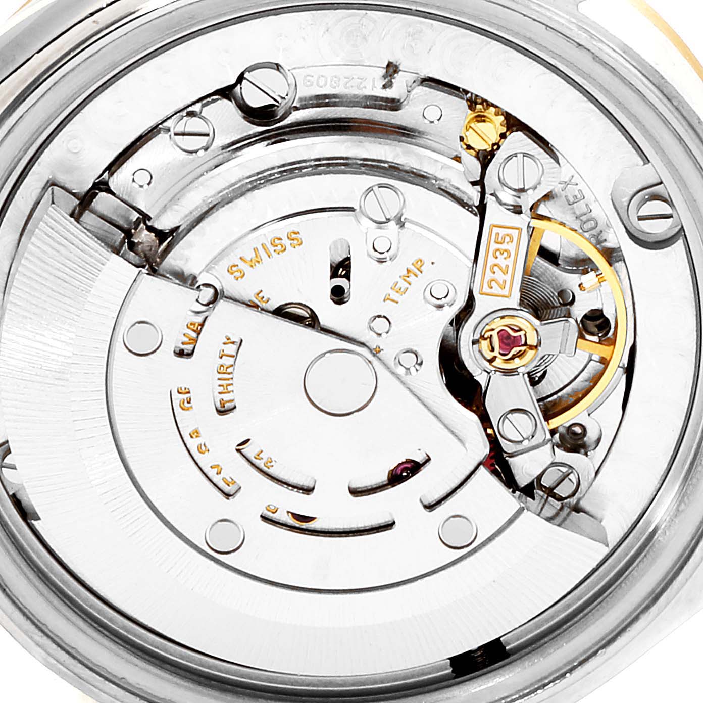The image shows a close-up view of the movement mechanism of a Rolex Mid-Size 78273 Women
s Steel and Gold (two tone) White Dial 78273 Women
s Steel and Gold (two tone) White Dial watch.