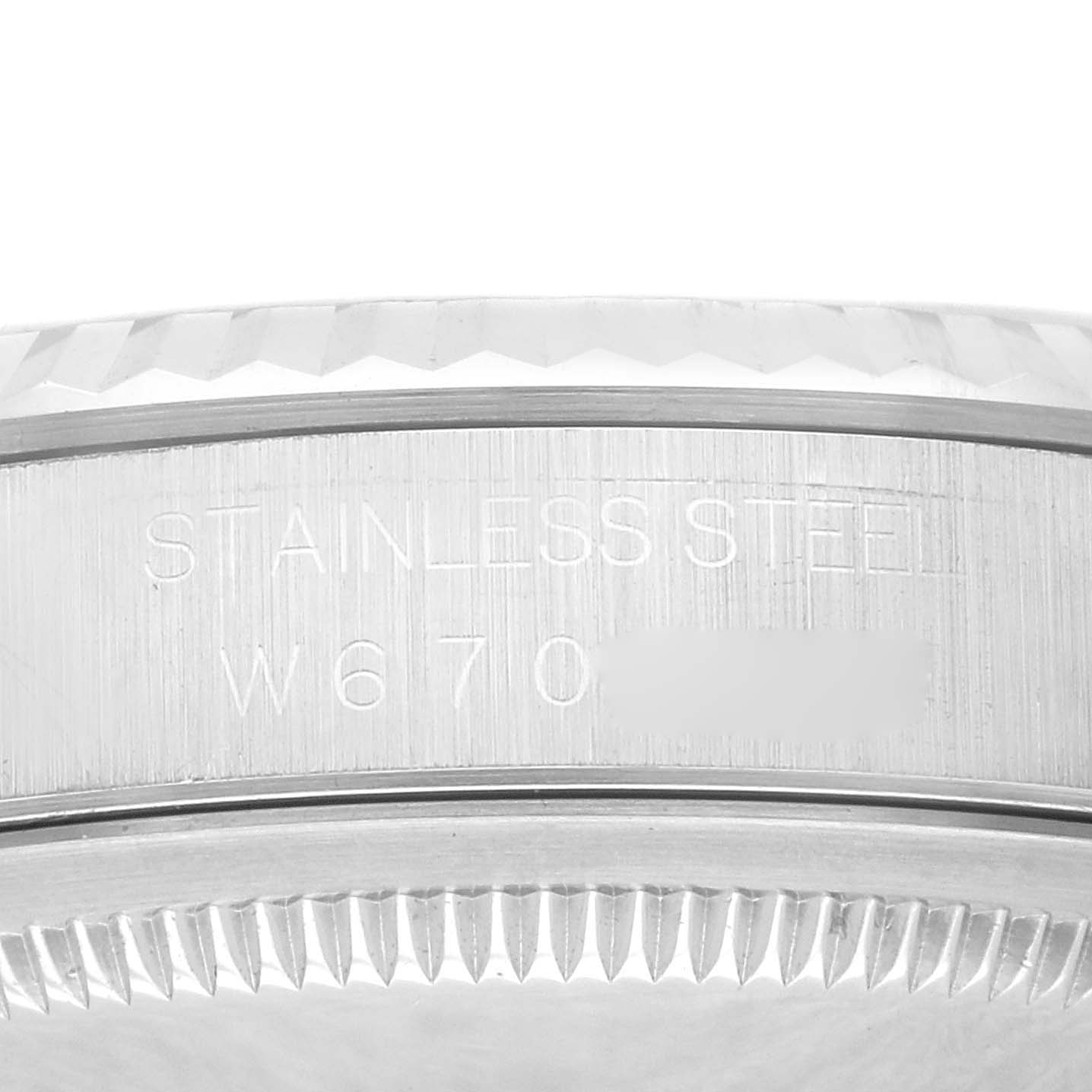 This image shows the detailed side view of the stainless steel case and serrated bezel of a Rolex Datejust 16234 Men's Stainless Steel Pink Dial 16234 Men's Stainless Steel Pink Dial watch.