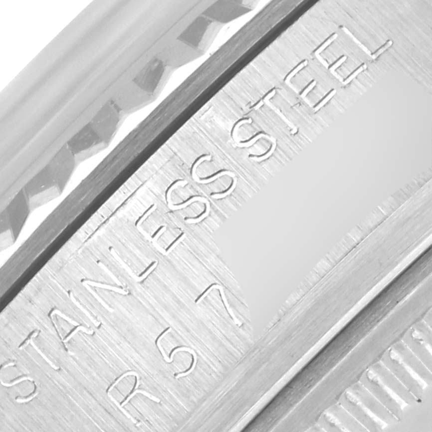 The image shows a close-up of the engraved stainless steel part of the Rolex Datejust 16014 Men's Stainless Steel Silver Dial 16014 Men's Stainless Steel Silver Dial's bezel or inner rim.