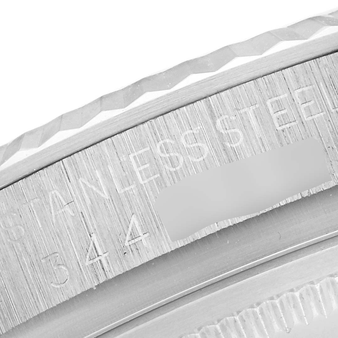 The image shows a close-up of the edge of the case back of a Rolex Datejust 1601 Men's Stainless Steel Silver Dial 1601 Men's Stainless Steel Silver Dial, highlighting the "STAINLESS STEEL" engraving.