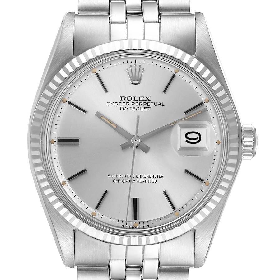 The Rolex Datejust watch is shown from a front angle, detailing the dial, fluted bezel, and bracelet.