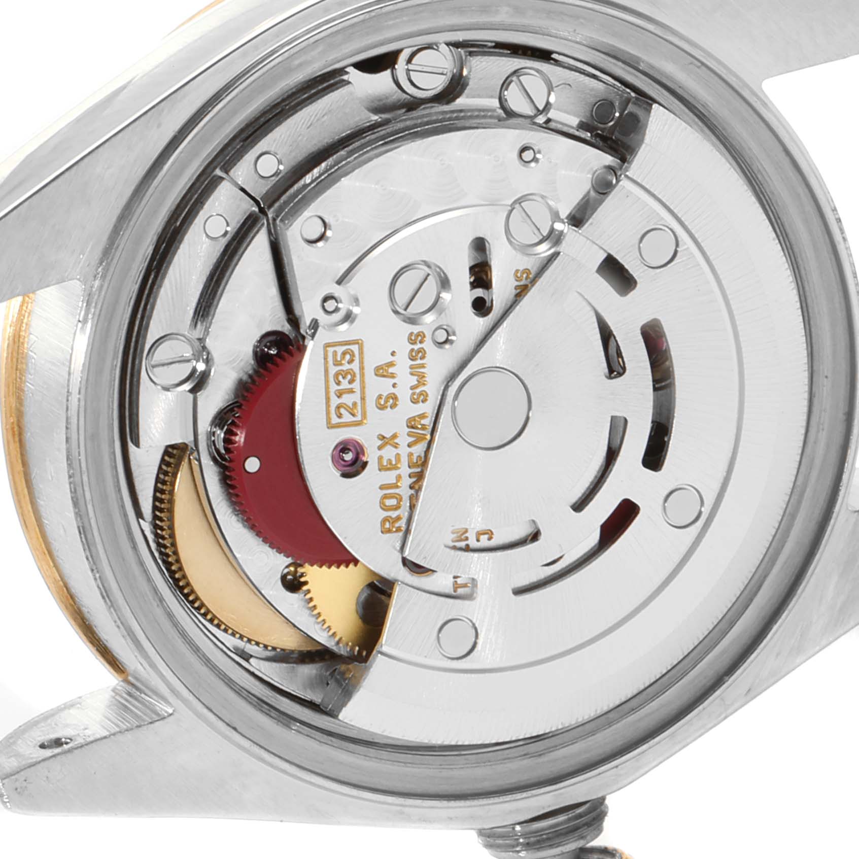 The image shows a close-up of the movement mechanism of the Rolex Datejust 79173 Women's Steel and Gold (two tone) Blue Dial 79173 Women's Steel and Gold (two tone) Blue Dial watch from a rear angle.